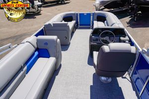 2026 Sun Tracker Party Barge 20 DLX interior with gray seating and steering console.