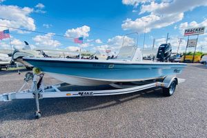2013 Mako 18 LTS boat on trailer, displayed outdoors under blue sky.