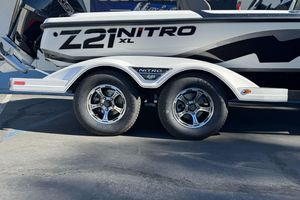 2026 Nitro Z21 XL Pro boat trailer with dual wheels, parked on concrete.