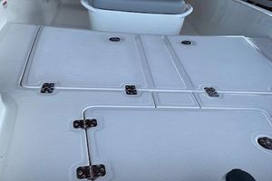 2026 Mako Pro Skiff 15 CC boat deck with storage compartments.