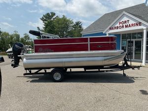 2026 Sun Tracker PB 16 DLX pontoon boat at Port Harbor Marine dealership.