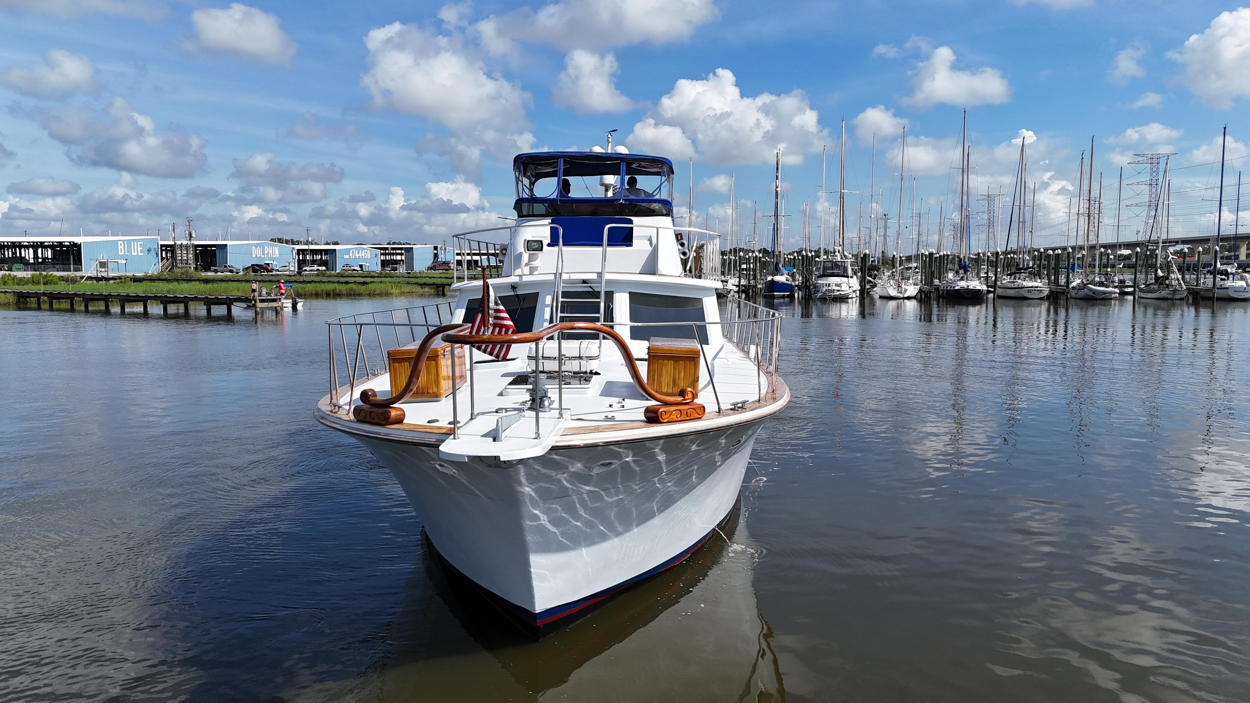 Bertram-58 Convertible Custom Total Rebuild 2010 1980-Liberty Belle TX-US-1980 Bertram 58 Convertible Custom yacht docked in a marina under a blue sky.-9430006 | Thumbnail