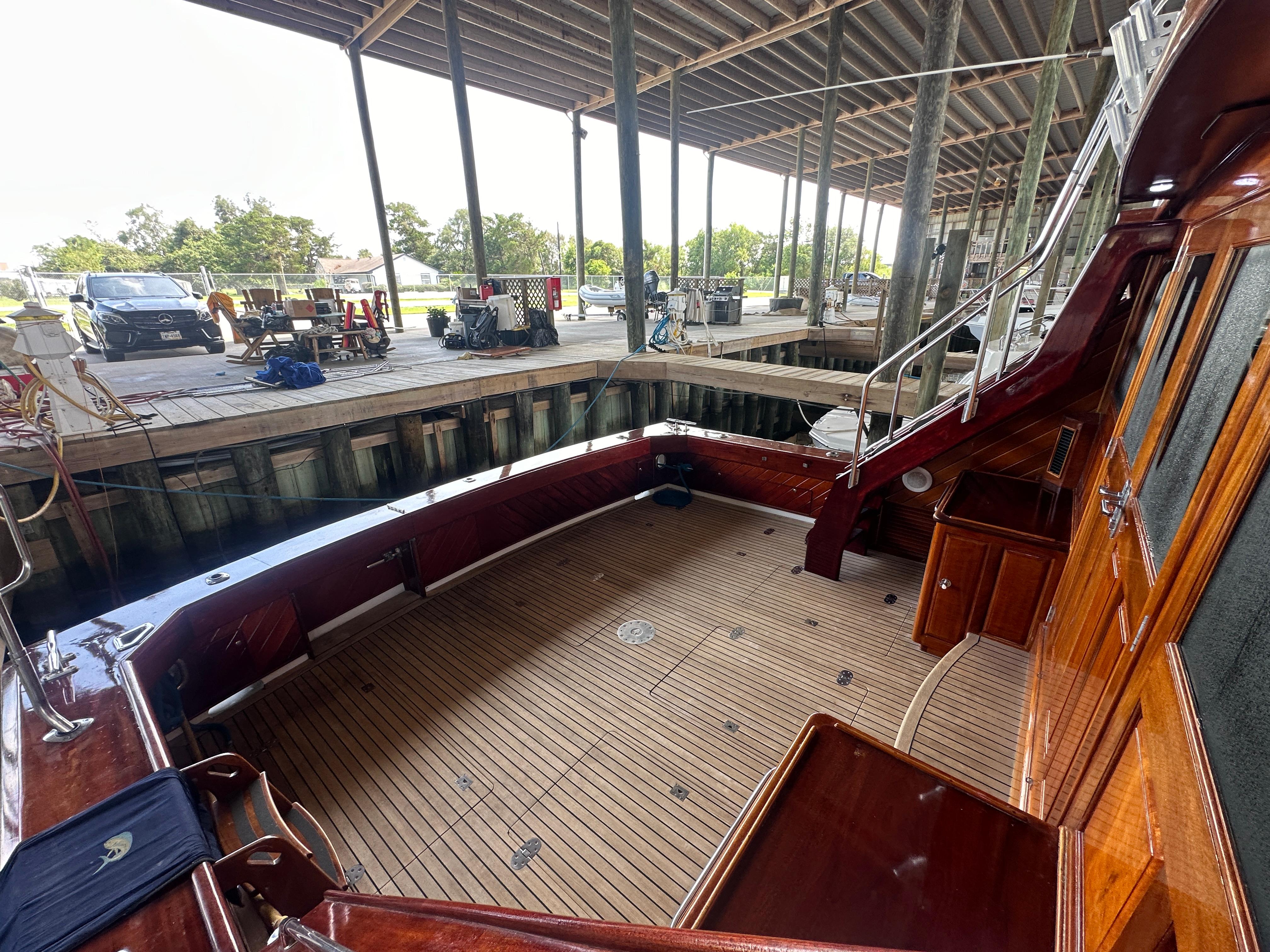 Bertram-58 Convertible Custom Total Rebuild 2010 1980-Liberty Belle TX-US-1980 Bertram 58 Convertible Custom yacht interior with wooden deck and dock view.-9430006 | Thumbnail