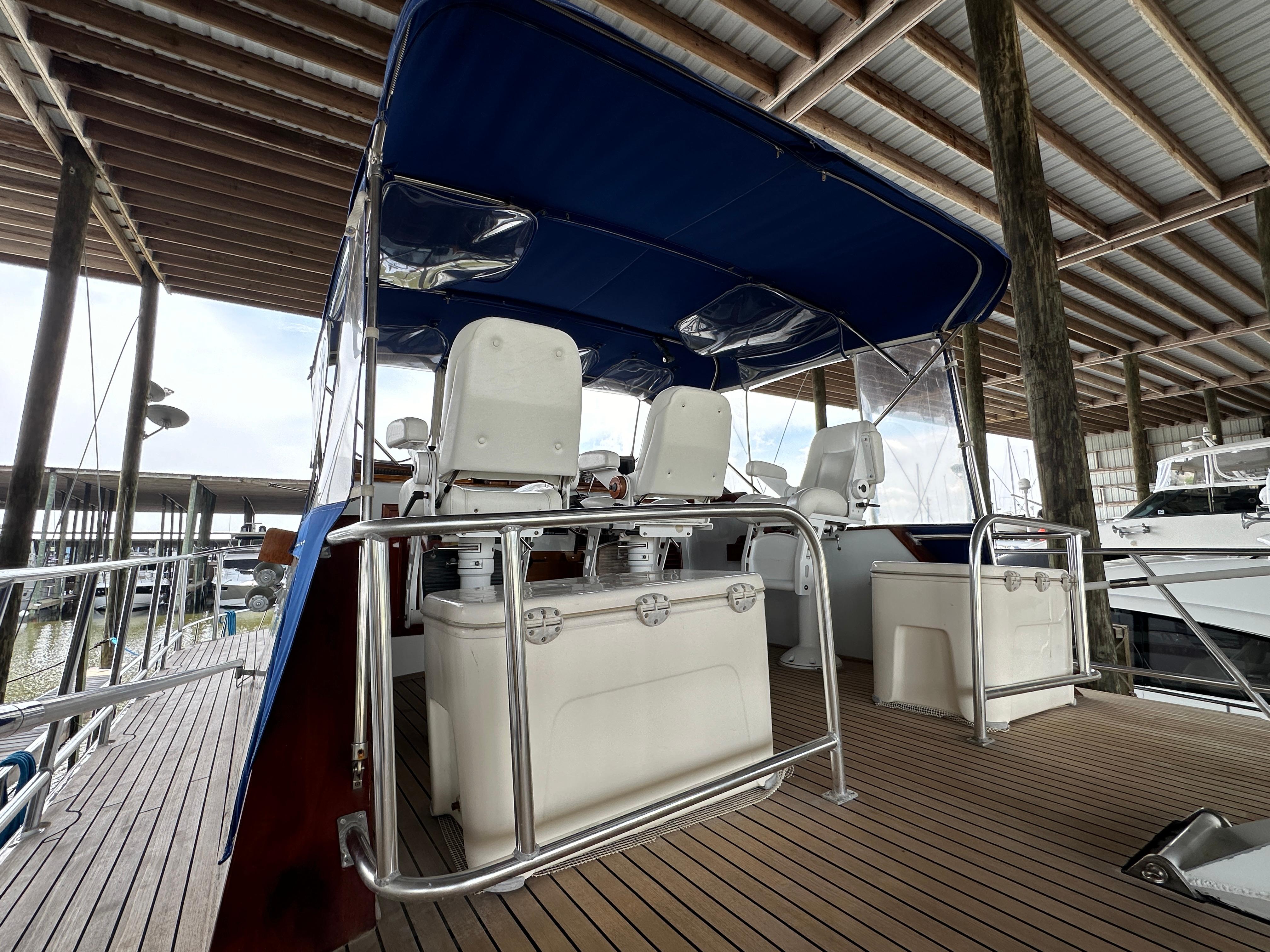 Bertram-58 Convertible Custom Total Rebuild 2010 1980-Liberty Belle TX-US-1980 Bertram 58 Convertible Custom yacht interior with seating under blue canopy.-9430006 | Thumbnail