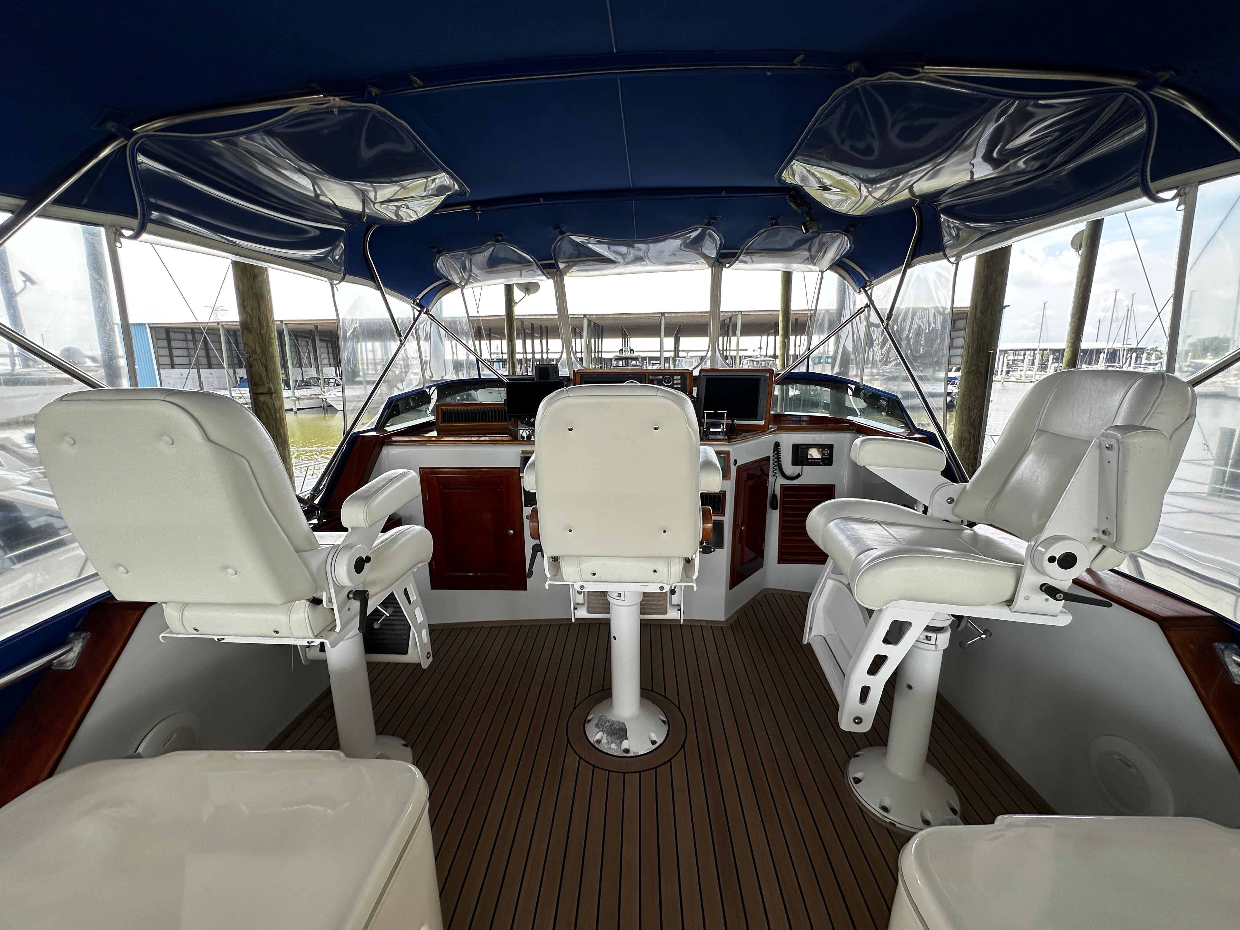 Bertram-58 Convertible Custom Total Rebuild 2010 1980-Liberty Belle TX-US-Interior of 1980 Bertram 58 Convertible Custom yacht with white captain chairs and wooden flooring.-9430006 | Thumbnail