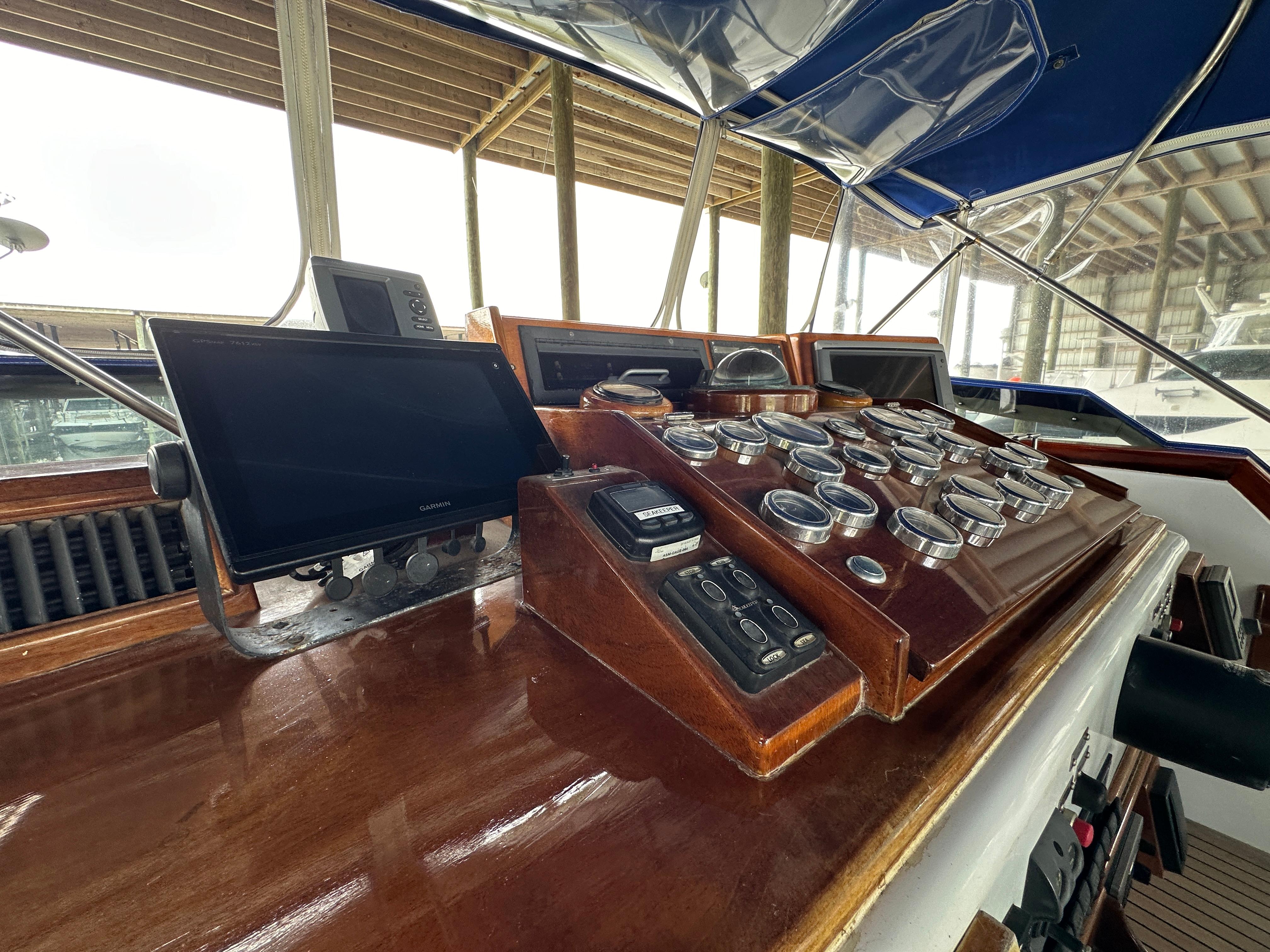 Bertram-58 Convertible Custom Total Rebuild 2010 1980-Liberty Belle TX-US-Control panel of 1980 Bertram 58 Convertible Custom yacht with wooden dashboard and gauges.-9430006 | Thumbnail
