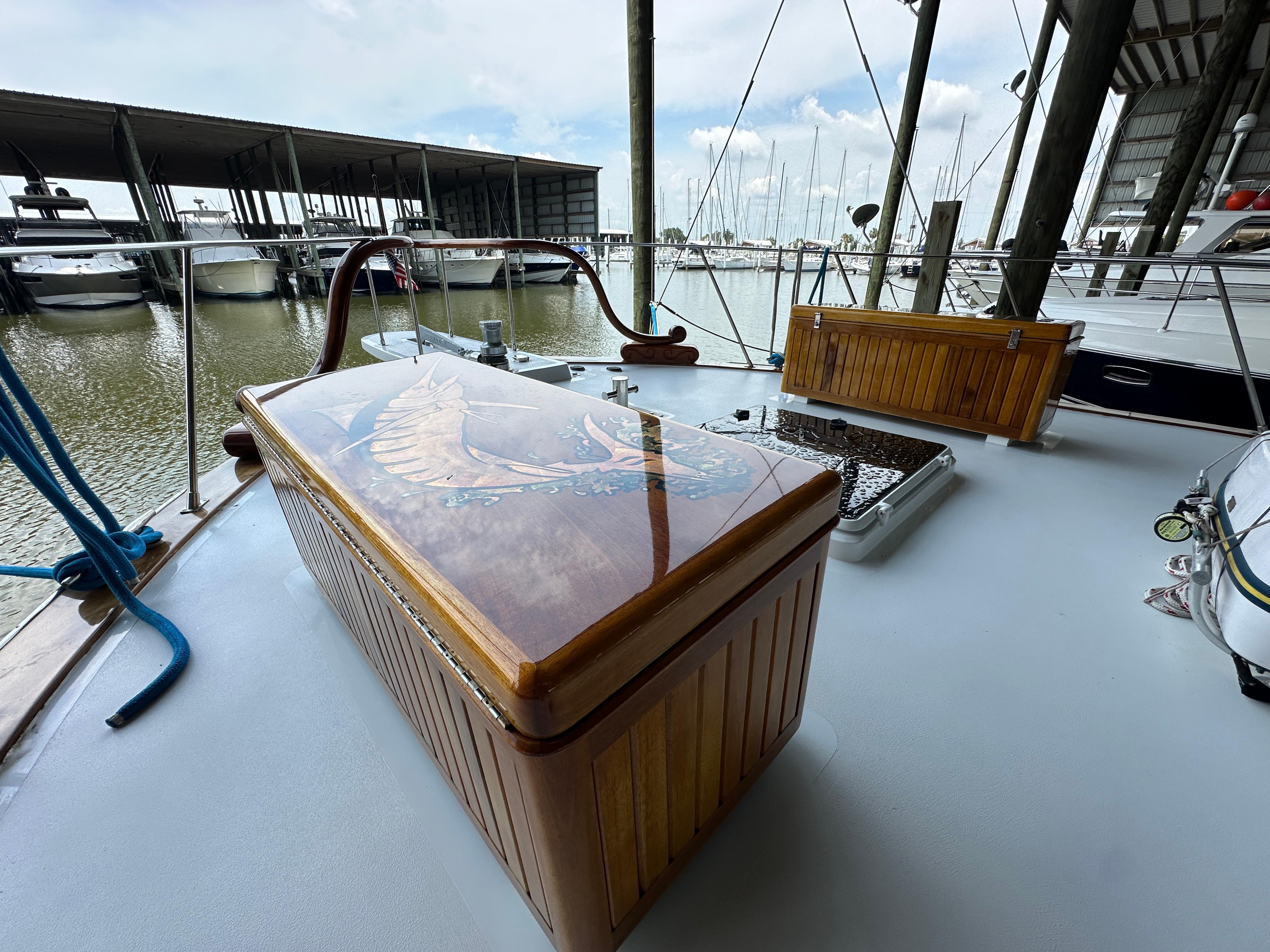 Bertram-58 Convertible Custom Total Rebuild 2010 1980-Liberty Belle TX-US-1980 Bertram 58 Convertible Custom yacht deck with wooden storage and marina view.-9430006 | Thumbnail