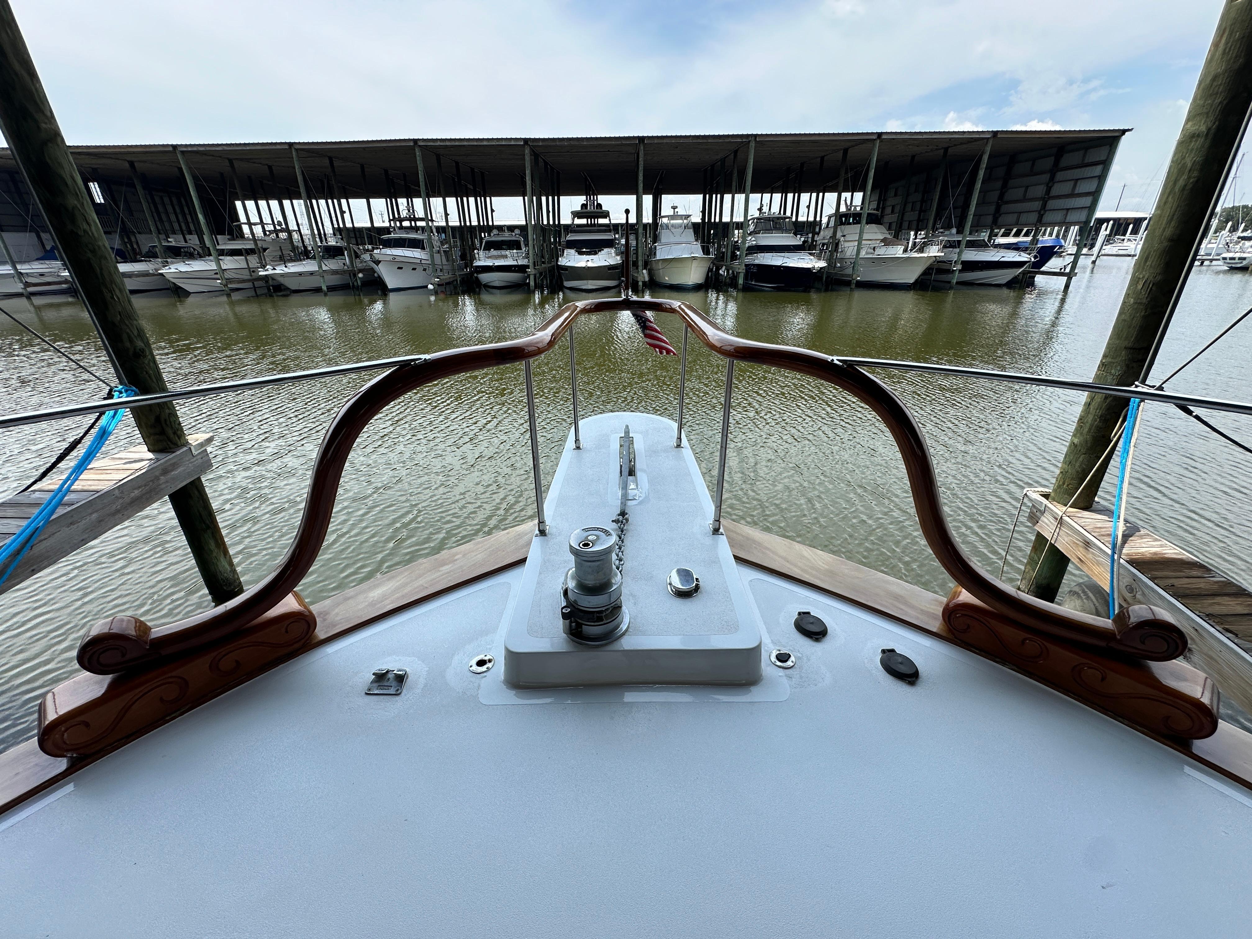 Bertram-58 Convertible Custom Total Rebuild 2010 1980-Liberty Belle TX-US-1980 Bertram 58 Convertible Custom yacht docked at marina, view from bow.-9430006 | Thumbnail