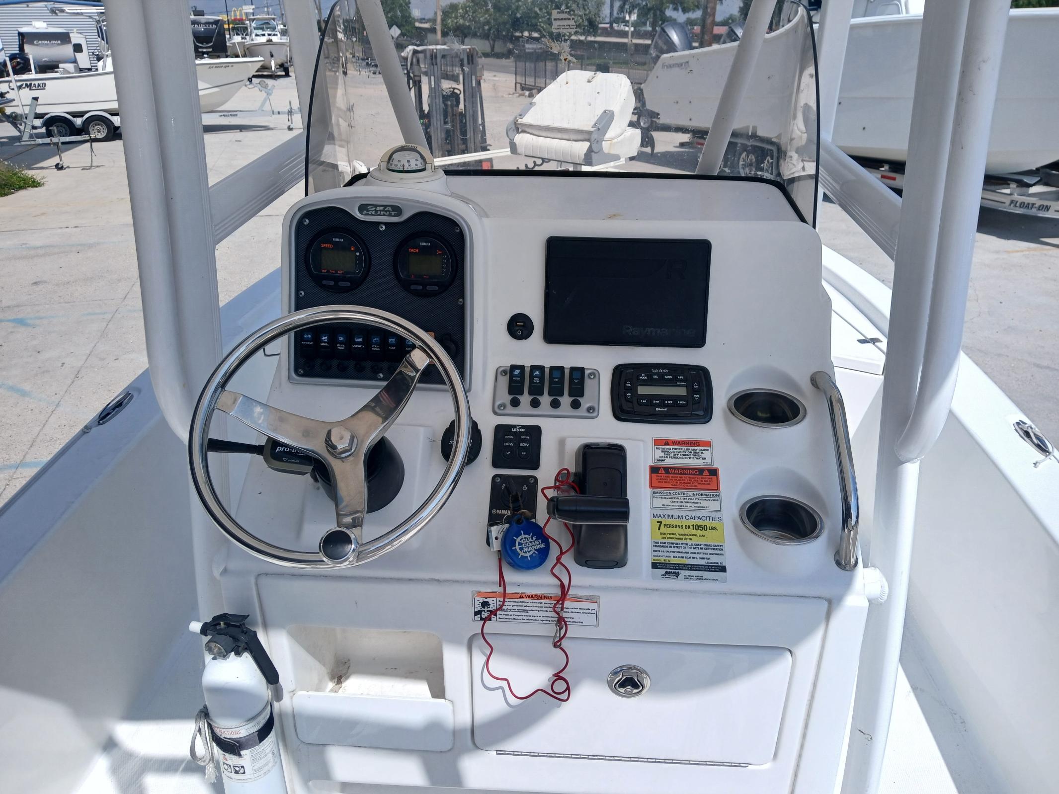 2014 Sea Hunt BX 22 BR boat console with steering wheel and navigation controls.