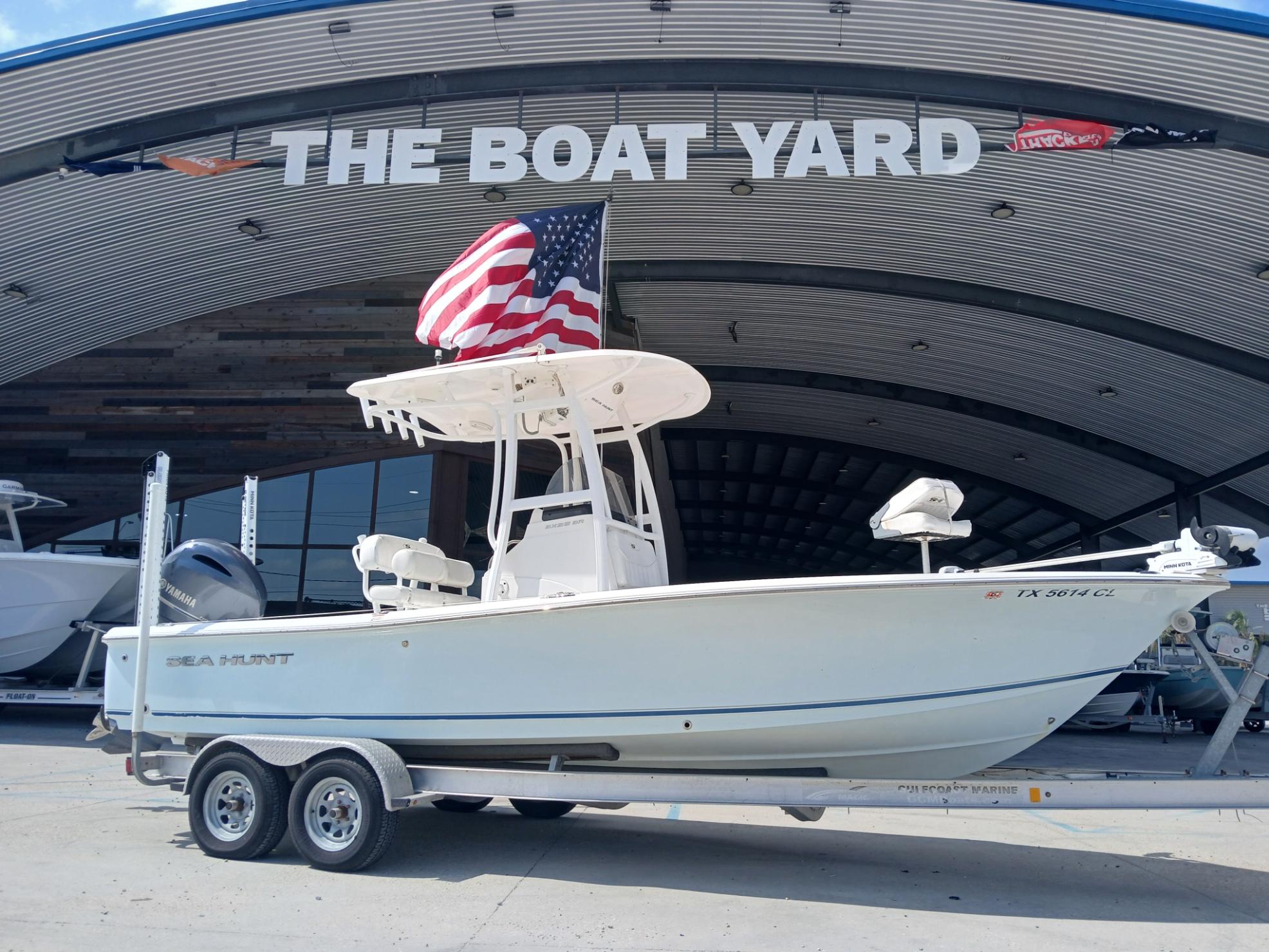 2014 Sea Hunt BX 22 BR boat with American flag at The Boat Yard.