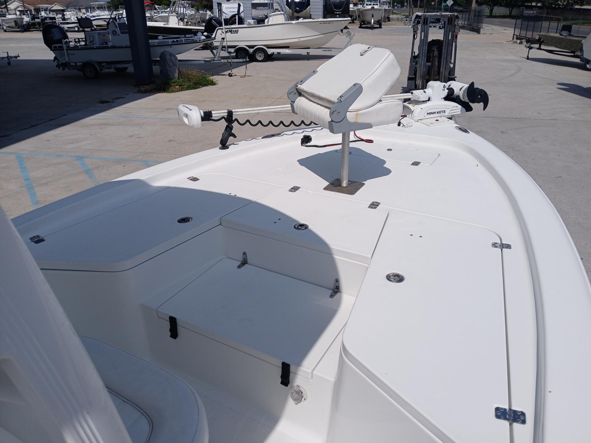 2014 Sea Hunt BX 22 BR boat deck with seating and equipment in a marina.