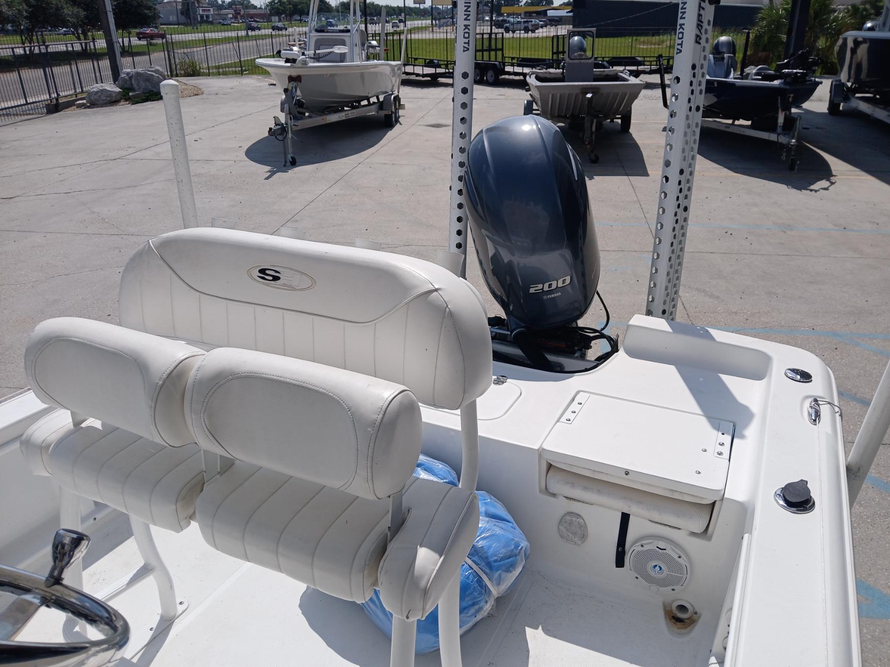 2014 Sea Hunt BX 22 BR boat interior with seating and outboard motor.
