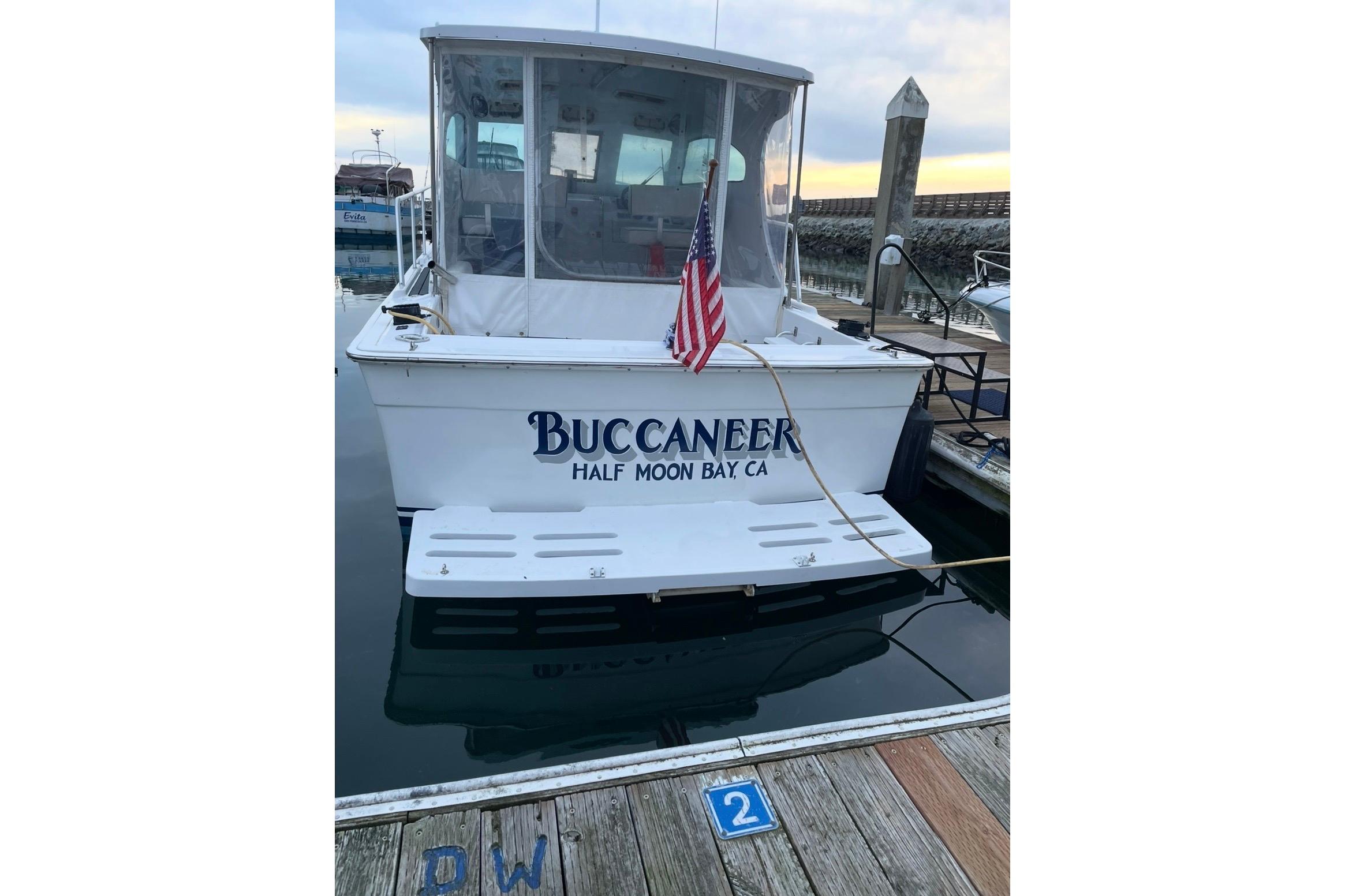 1999 Mainship Pilot 30 boat named "Buccaneer" docked at Half Moon Bay, CA.
