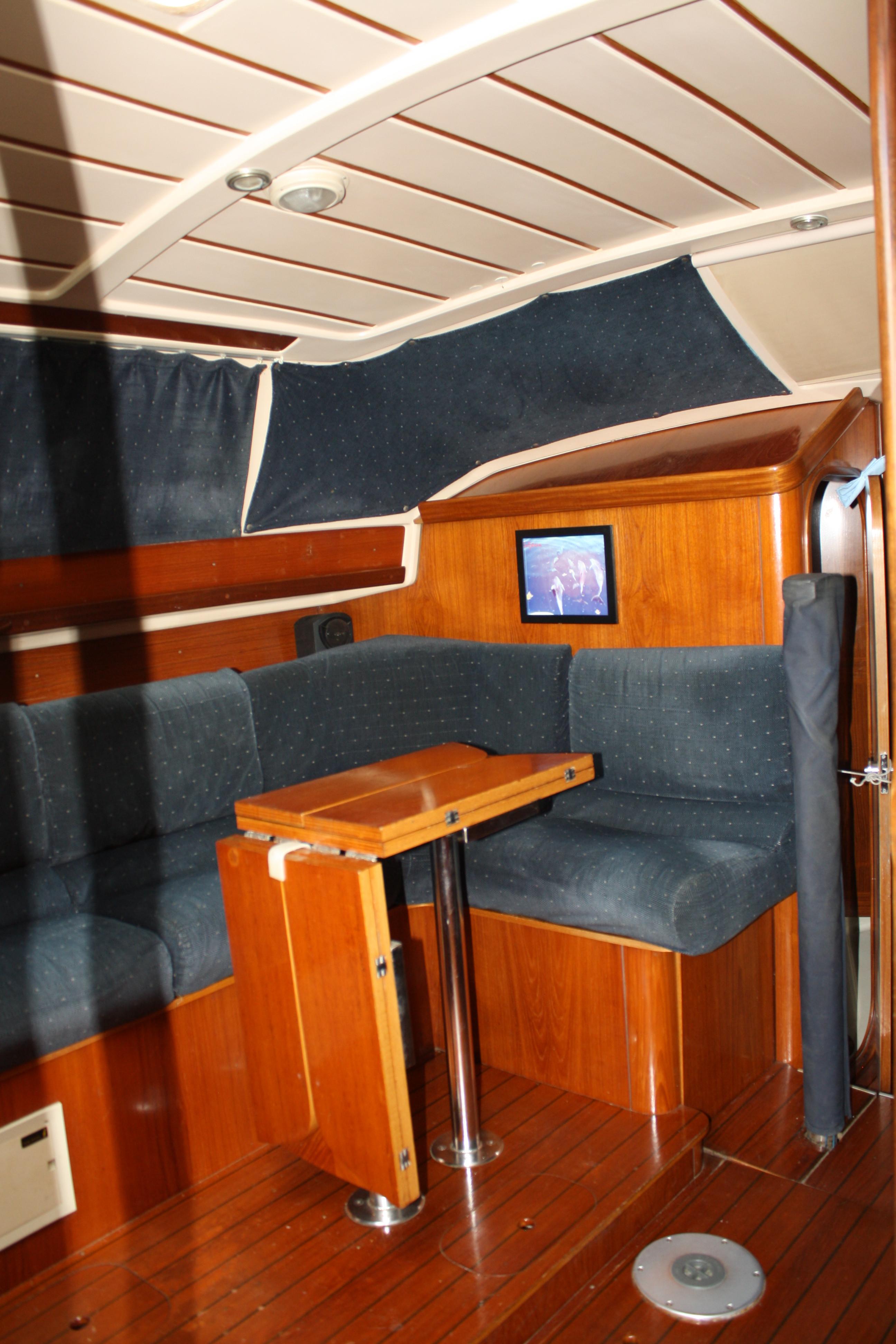 The "L" shaped bank seating at he dinette is plush and inviting. Additional seating may be added toward the centerline.