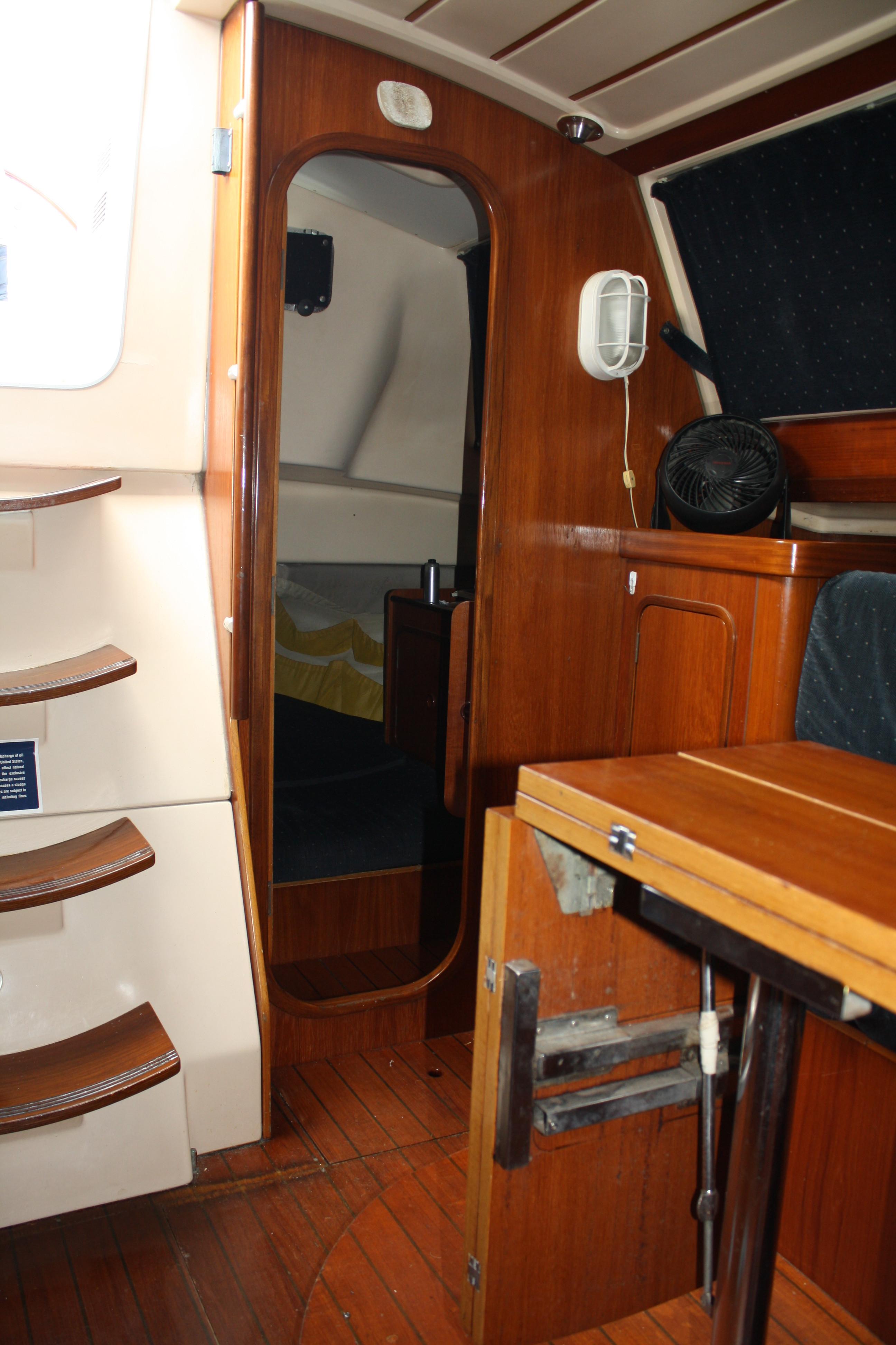 To port and just aft of the companionway is the second stateroom. The bunk in this cabin is enormous, with loads of easy access storage.