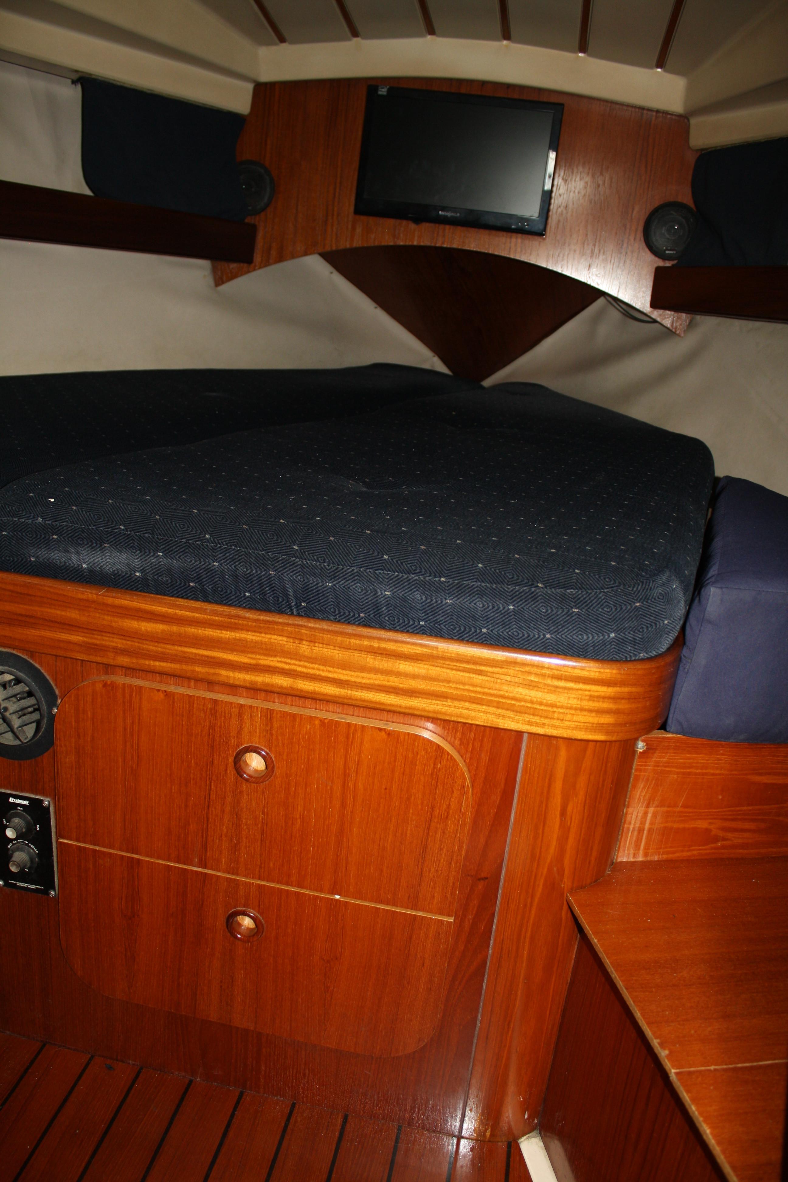 A good size V berth with storage makes up the owners stateroom.