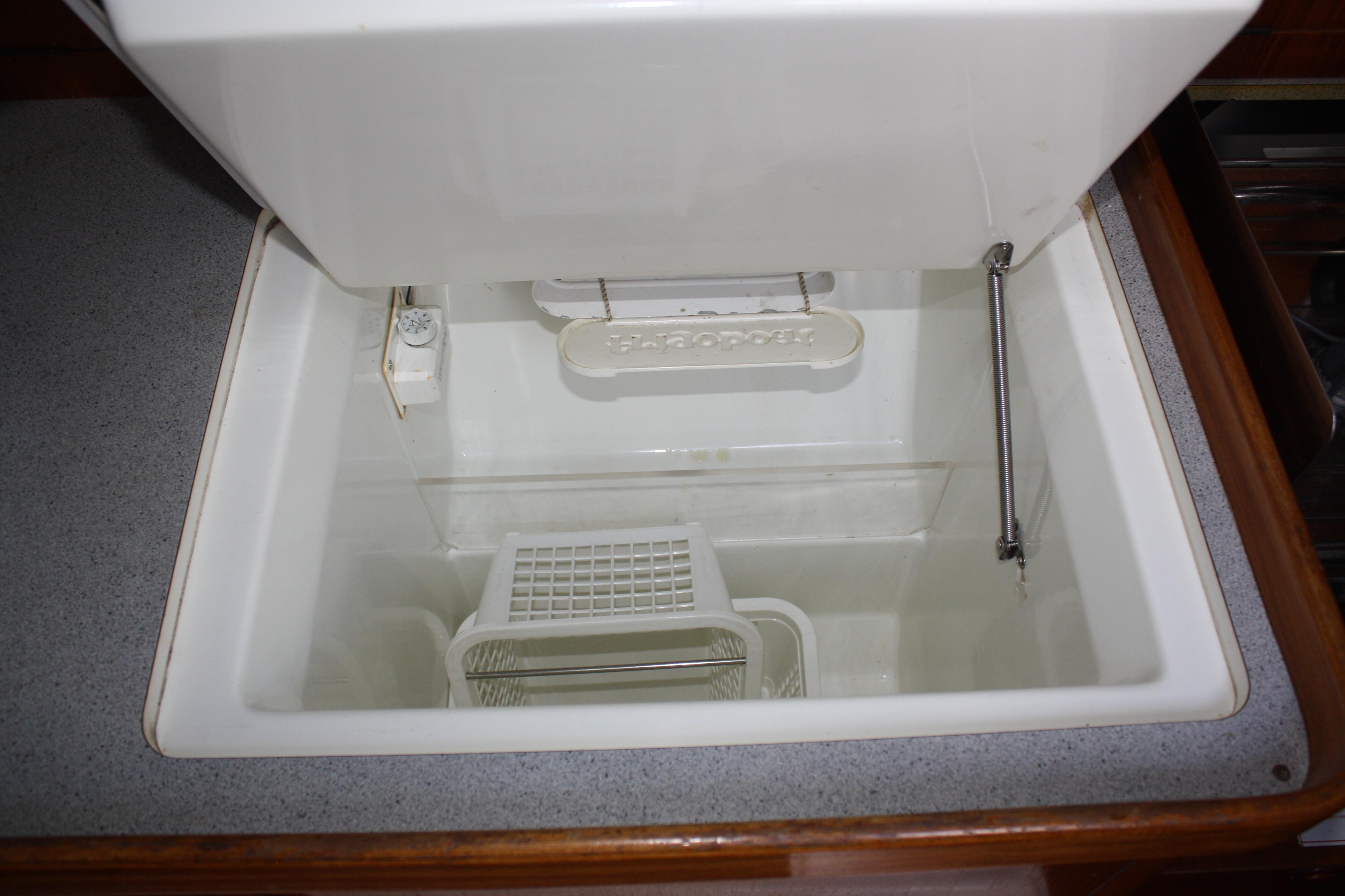 Large refrigerator and freezer along the starboard side.