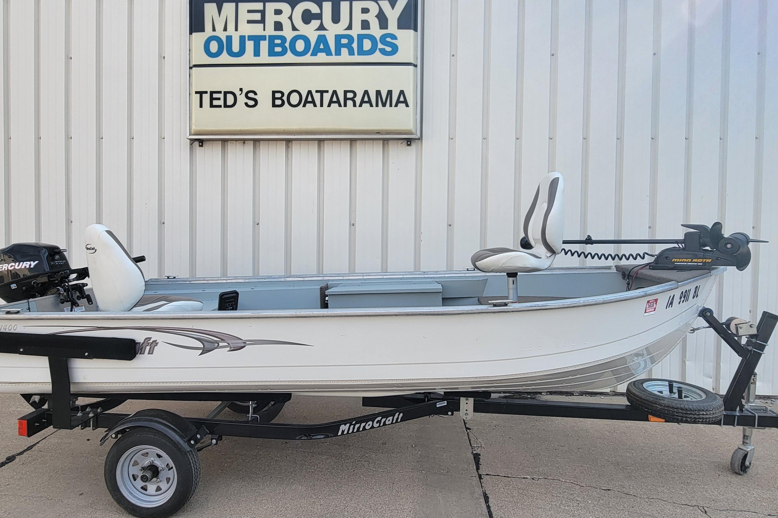 2014 MirroCraft 1400 boat on trailer at Ted's Boatarama, featuring Mercury outboard motor.