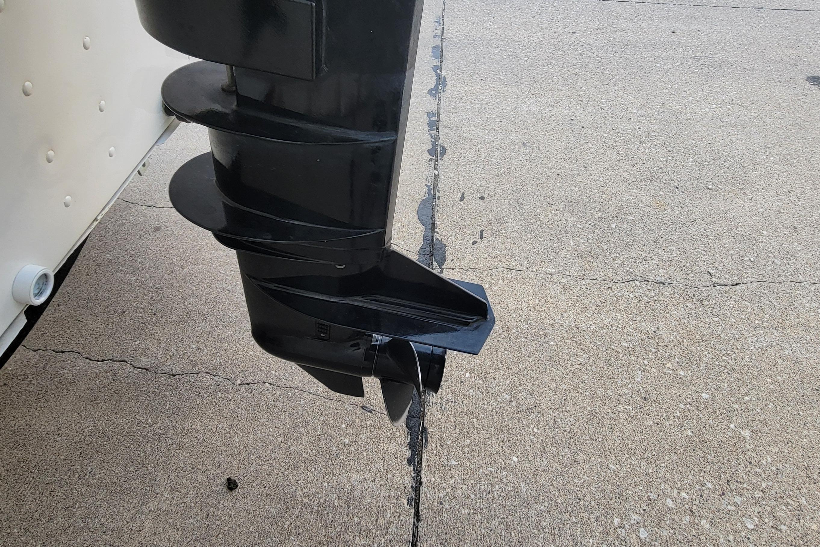 2014 MirroCraft 1400 boat motor propeller on concrete surface.