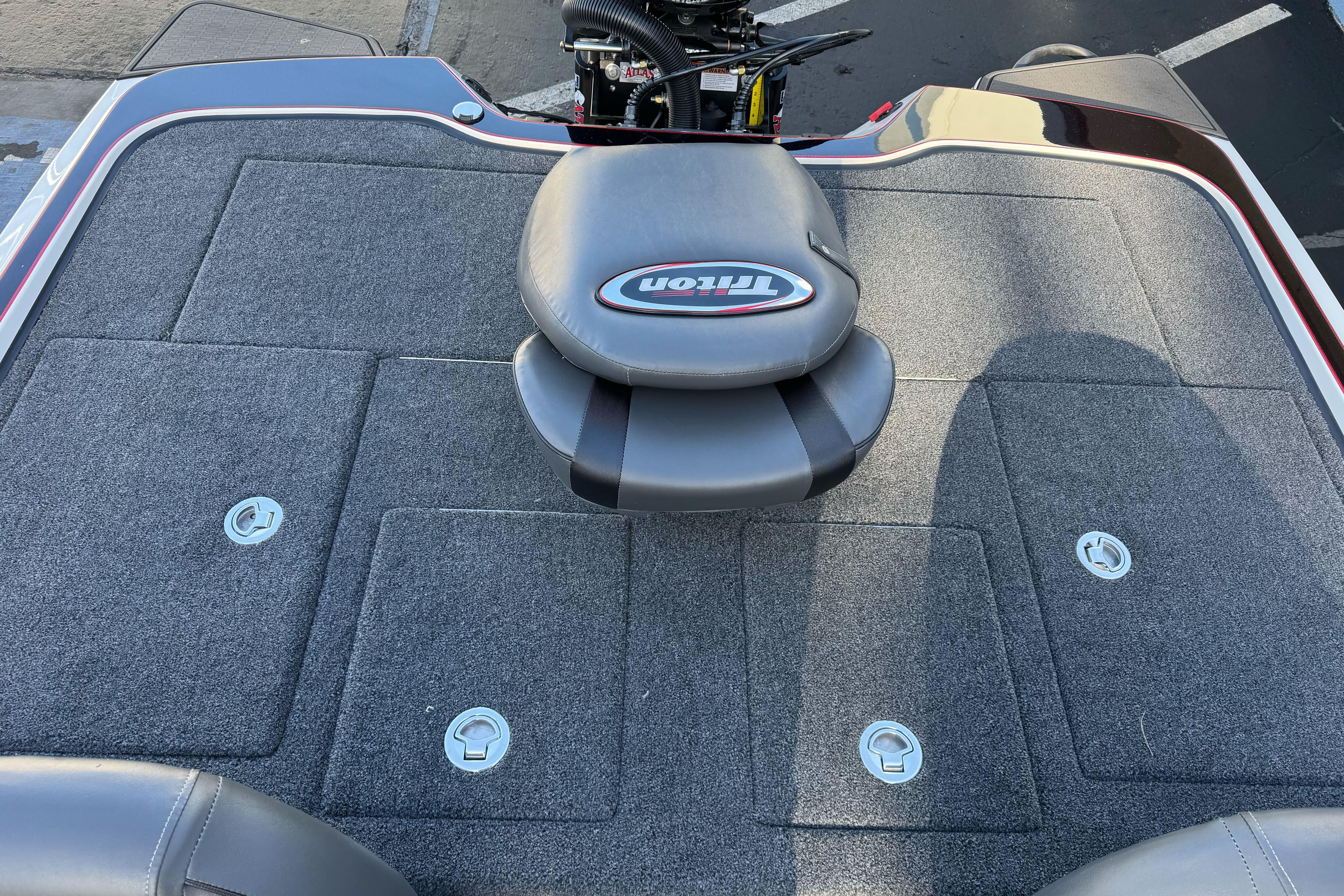 2026 Triton 20XP Patriot boat deck with seating and storage compartments.