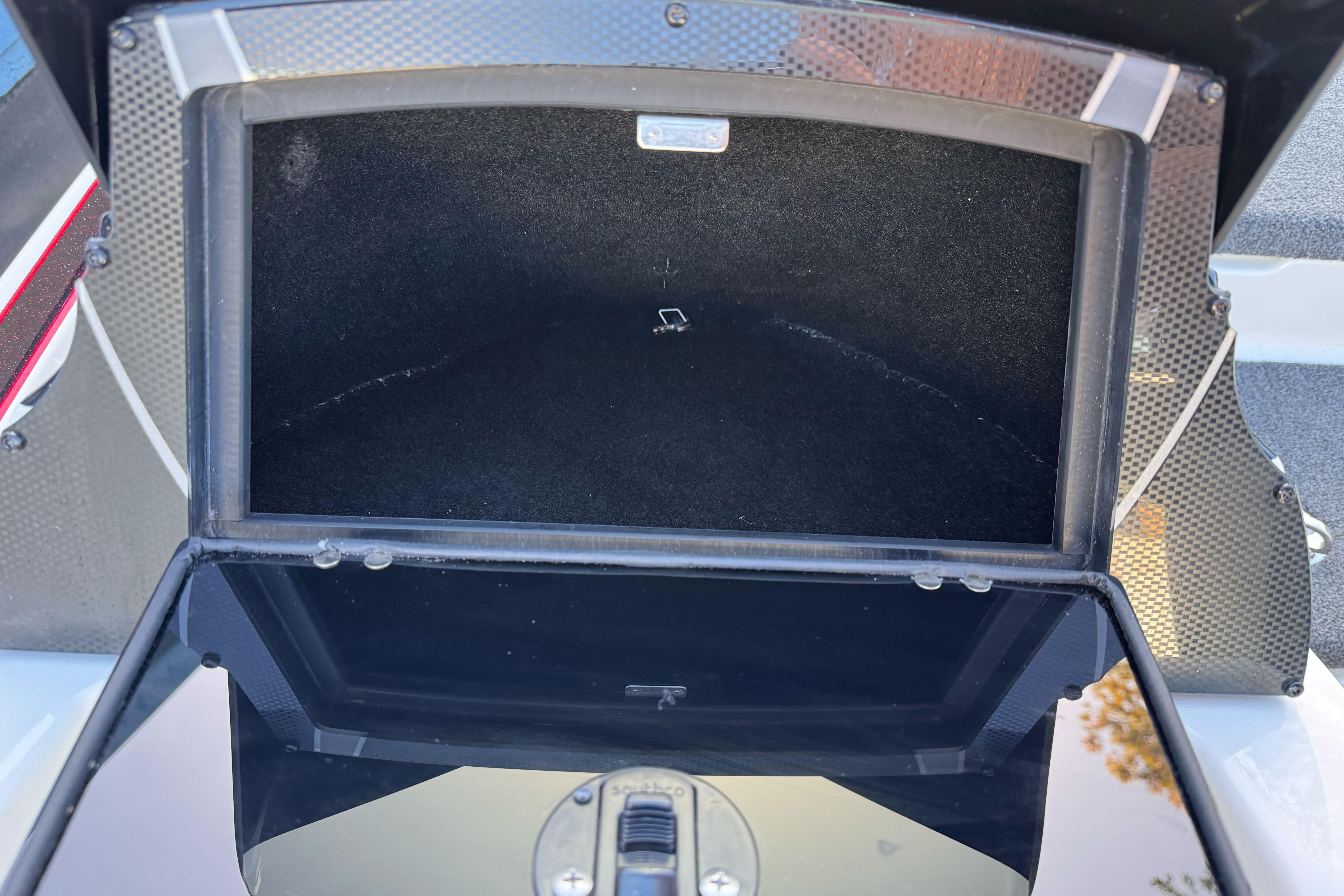 Open storage compartment of 2026 Triton 20XP Patriot boat.