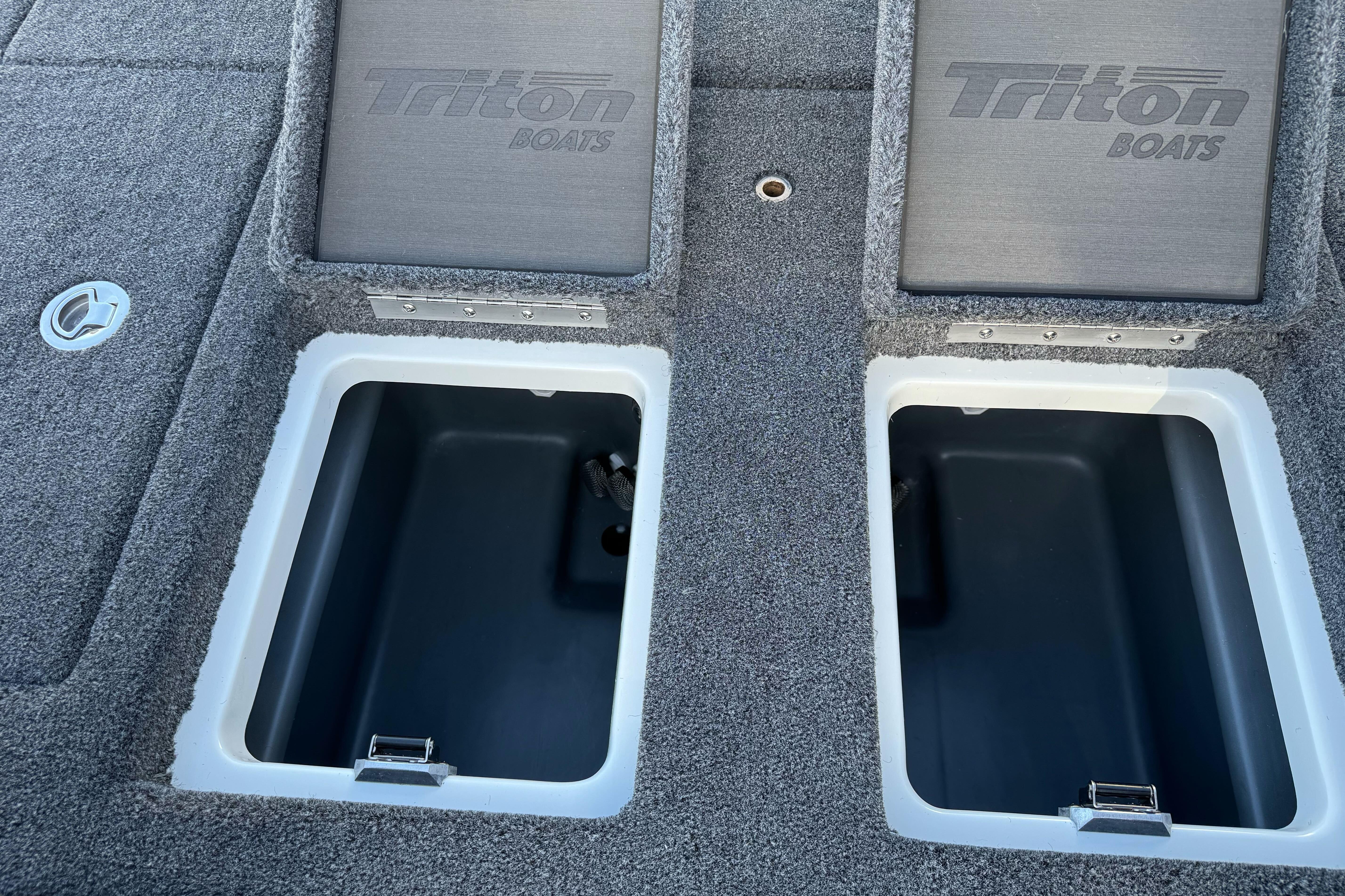 2026 Triton 20XP Patriot boat storage compartments with carpeted lids.