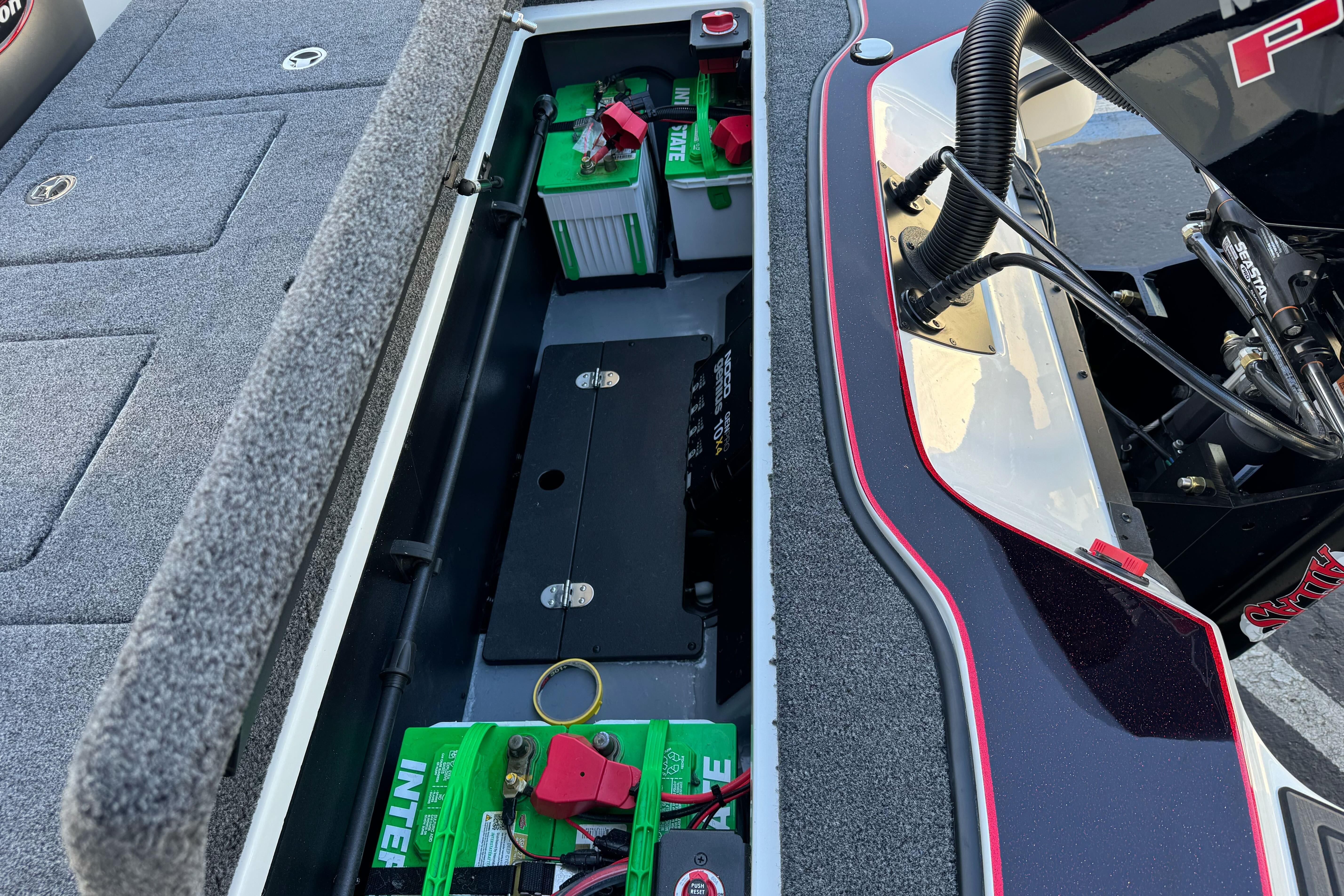 2026 Triton 20XP Patriot boat battery compartment with neatly arranged components.