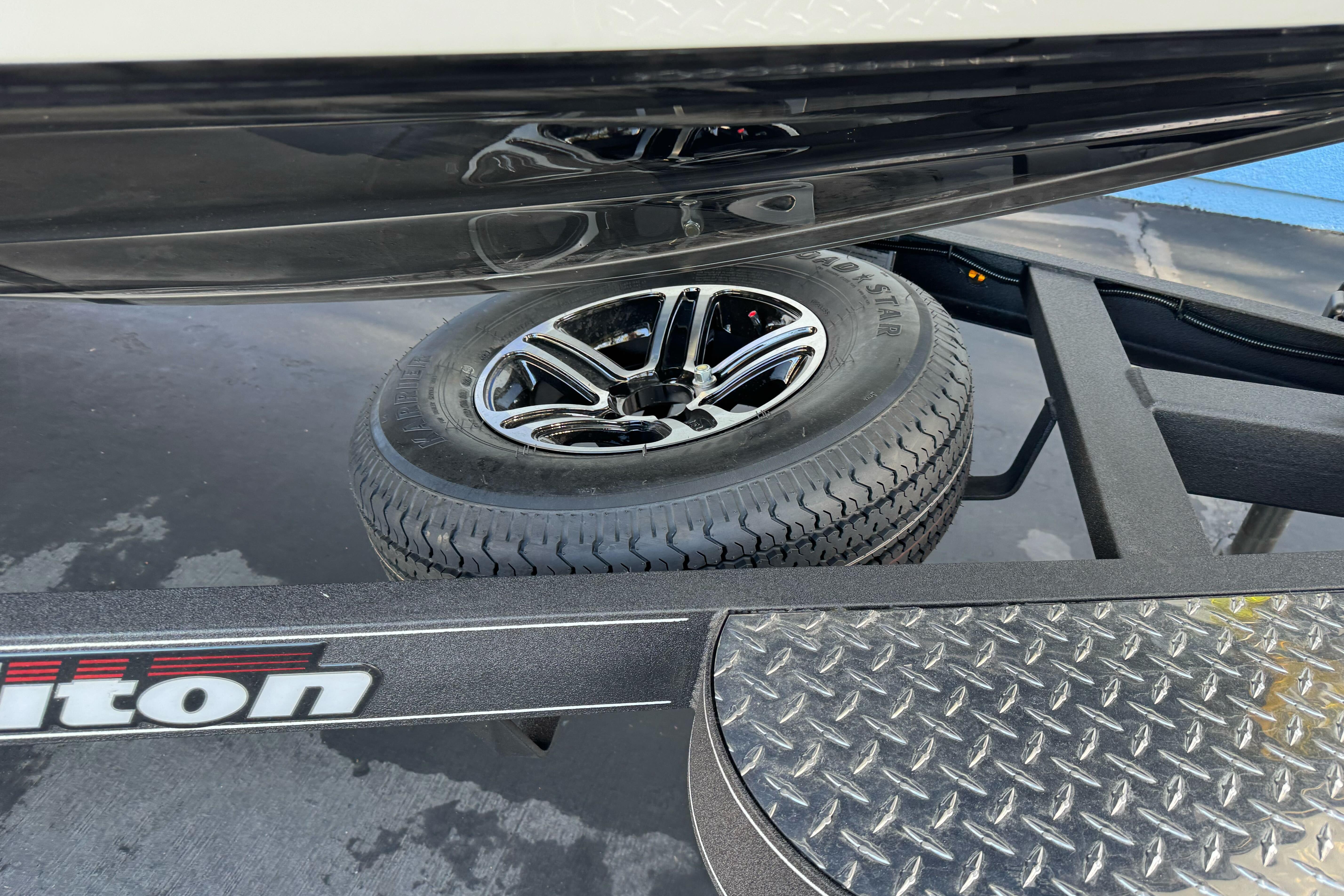 Triton 20XP Patriot 2026 trailer with spare tire and diamond plate detail.