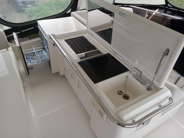 Modern kitchen area on 2016 Aquila 44 yacht with sink and grill.