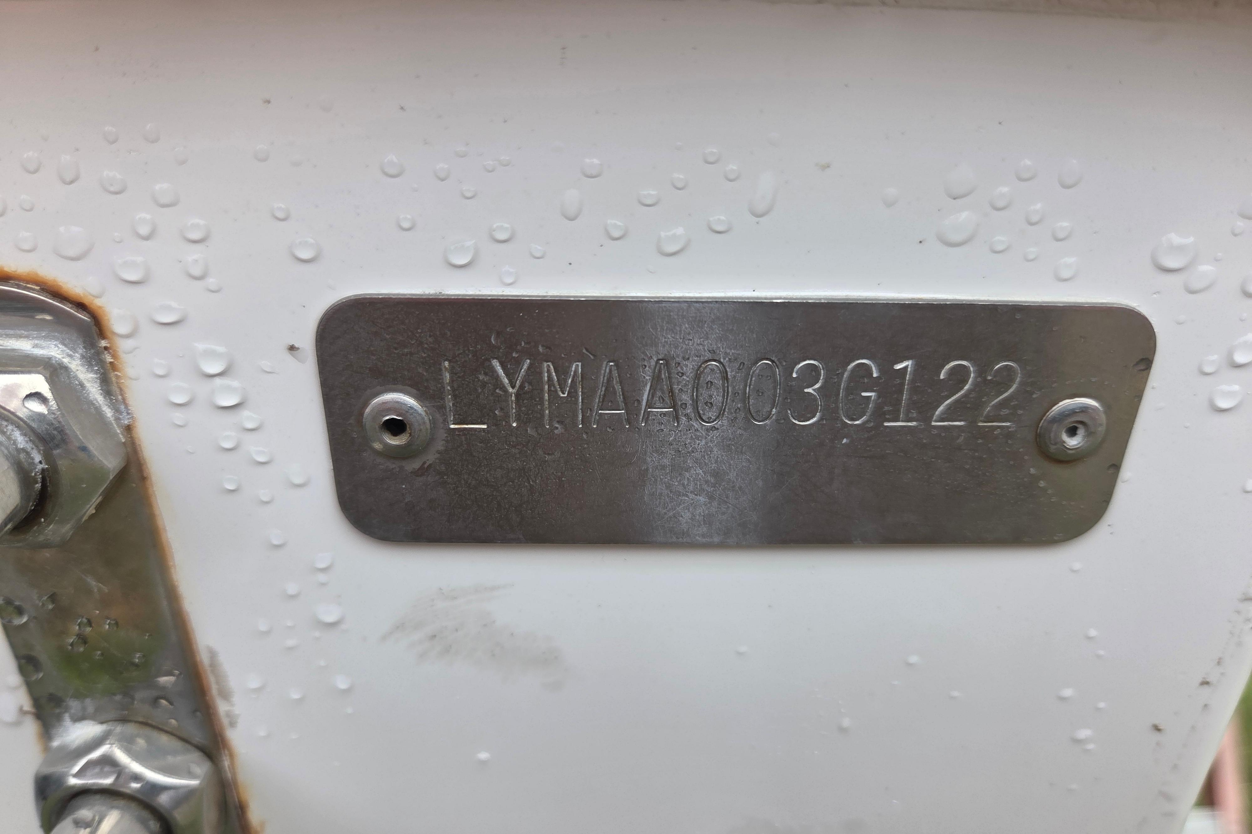 Metallic identification plate on Limestone L200CC 2022 boat, displaying serial number.