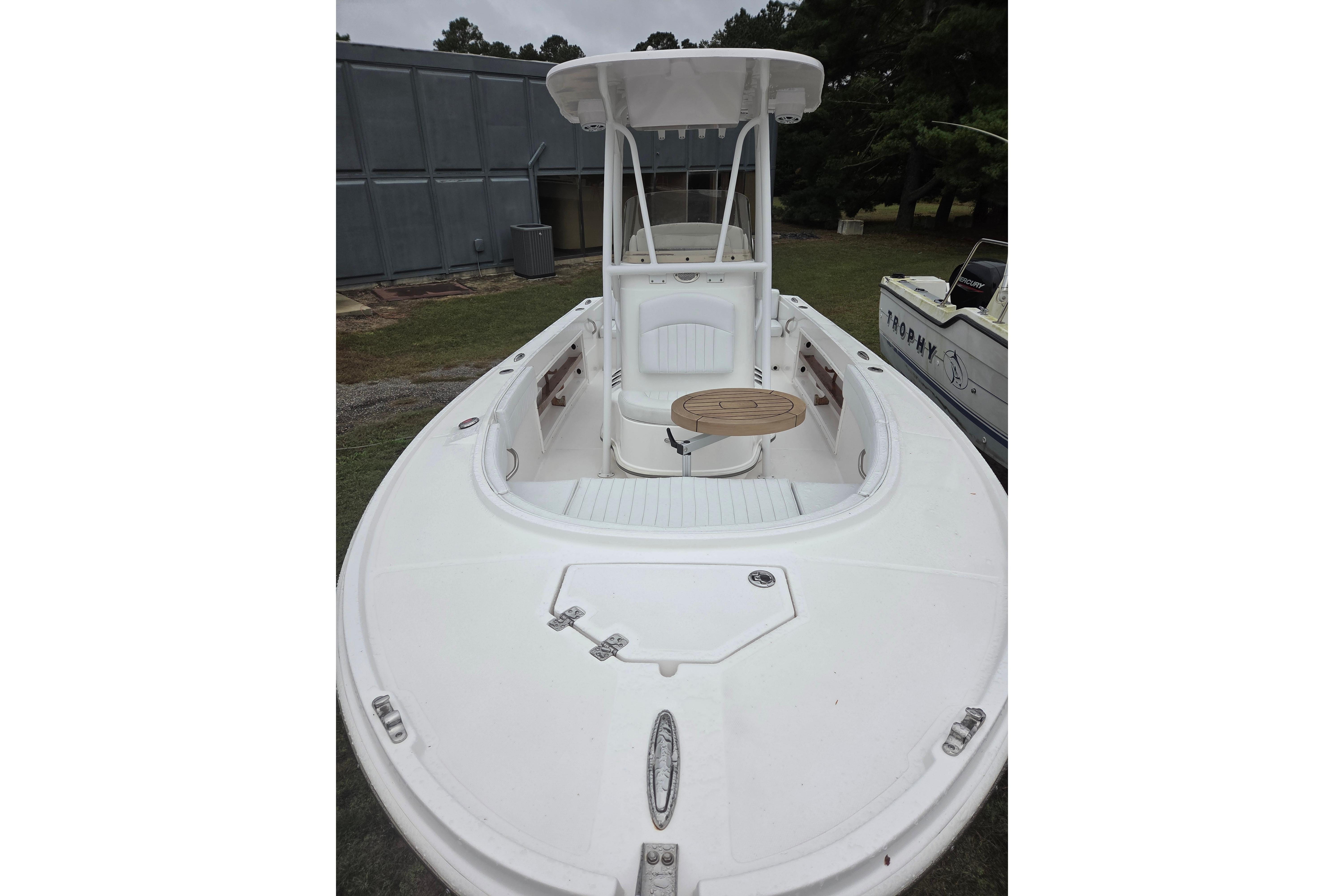 2022 Limestone L200CC boat with white deck and seating, displayed outdoors.