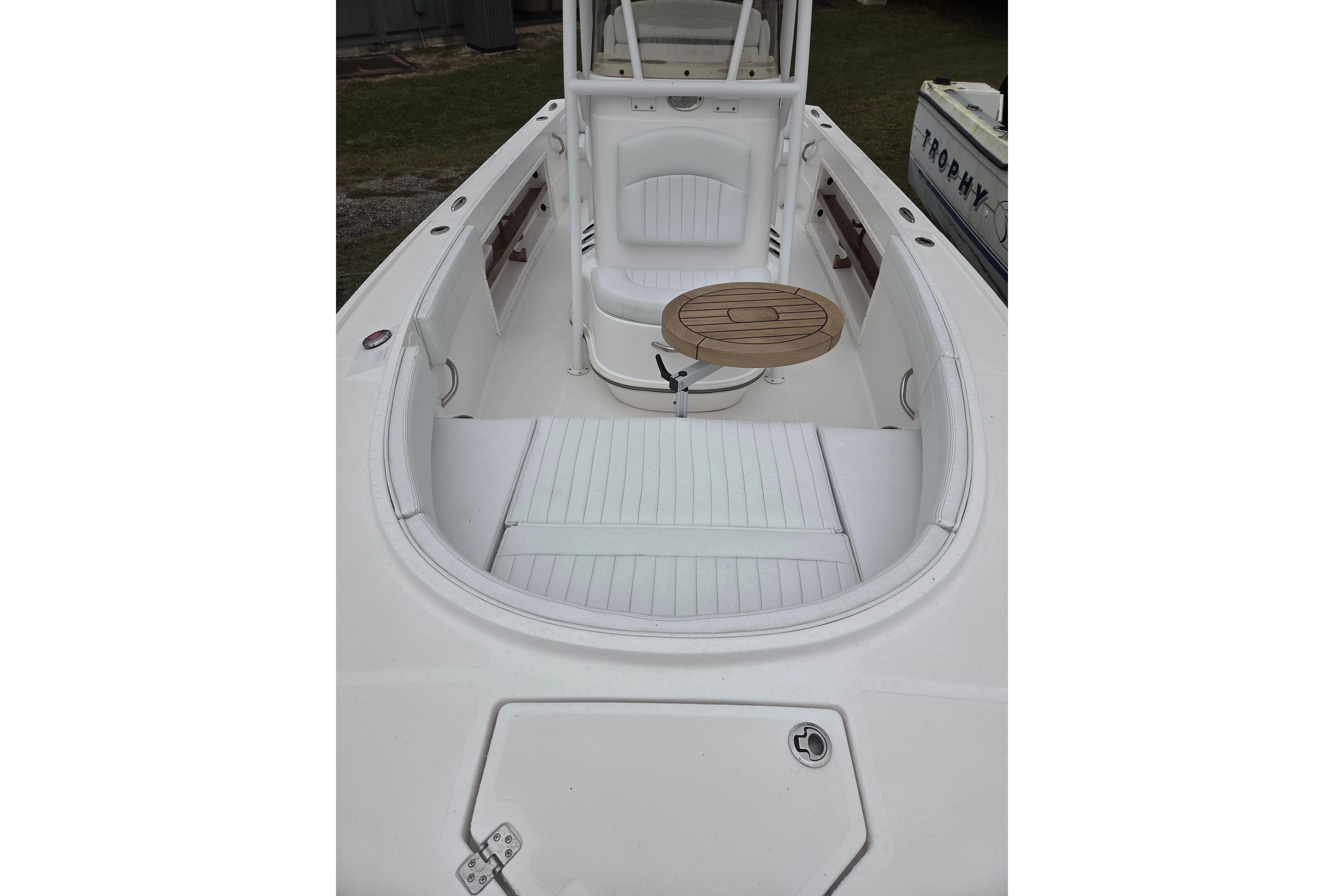 2022 Limestone L200CC boat interior with seating and a small table.