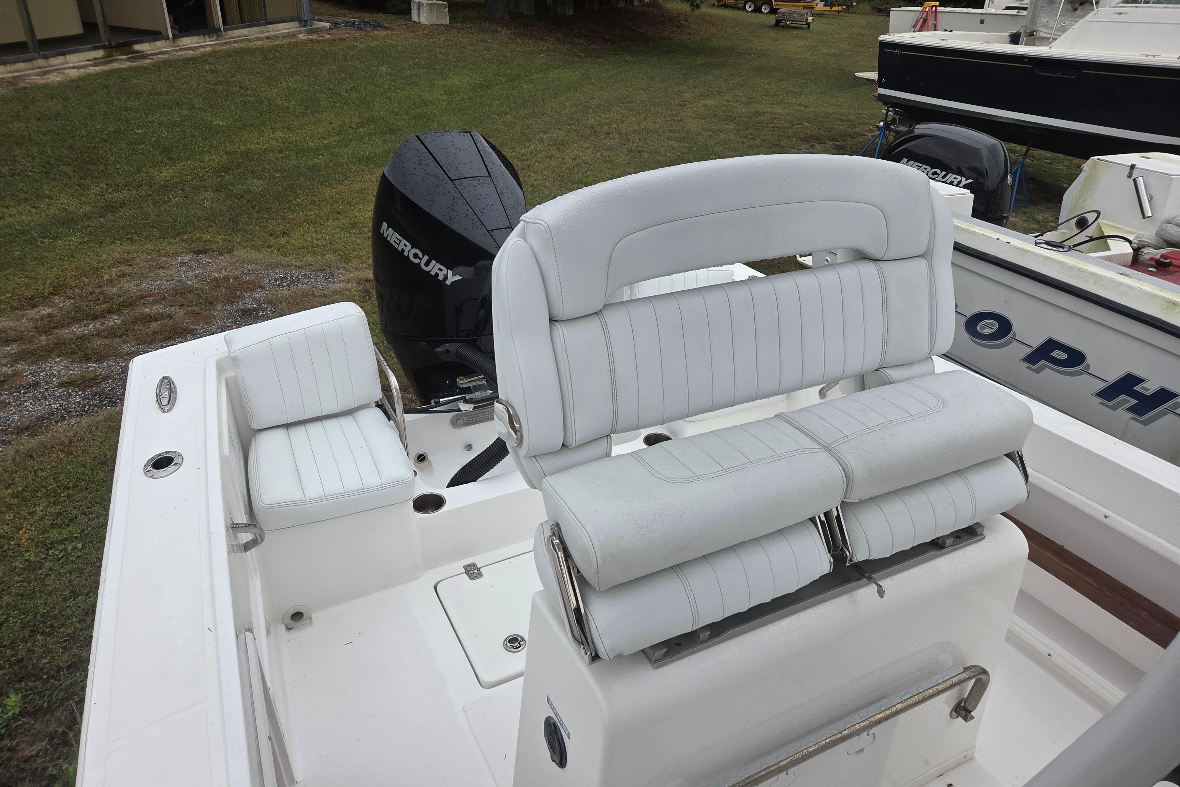 2022 Limestone L200CC boat with white seating and Mercury outboard motor.