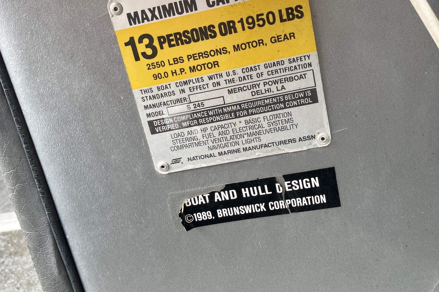 1990 Astro 24' Pontoon capacity plate, 13 persons or 1950 lbs, Brunswick Corporation design.