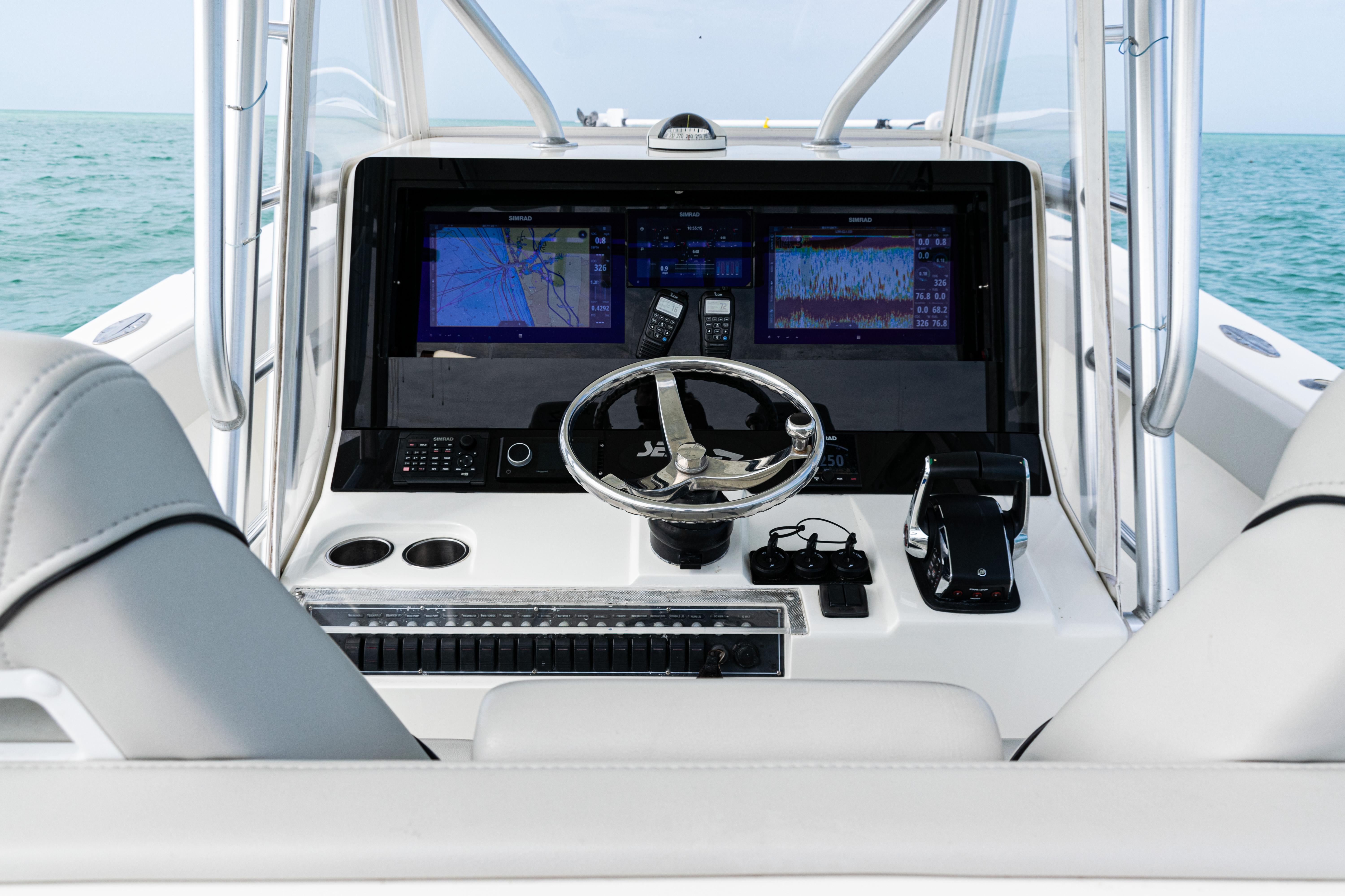 SeaVee-390Z 2015 -FL-US-2015 SeaVee 390Z boat dashboard with navigation screens and steering wheel.-9741010 | Thumbnail