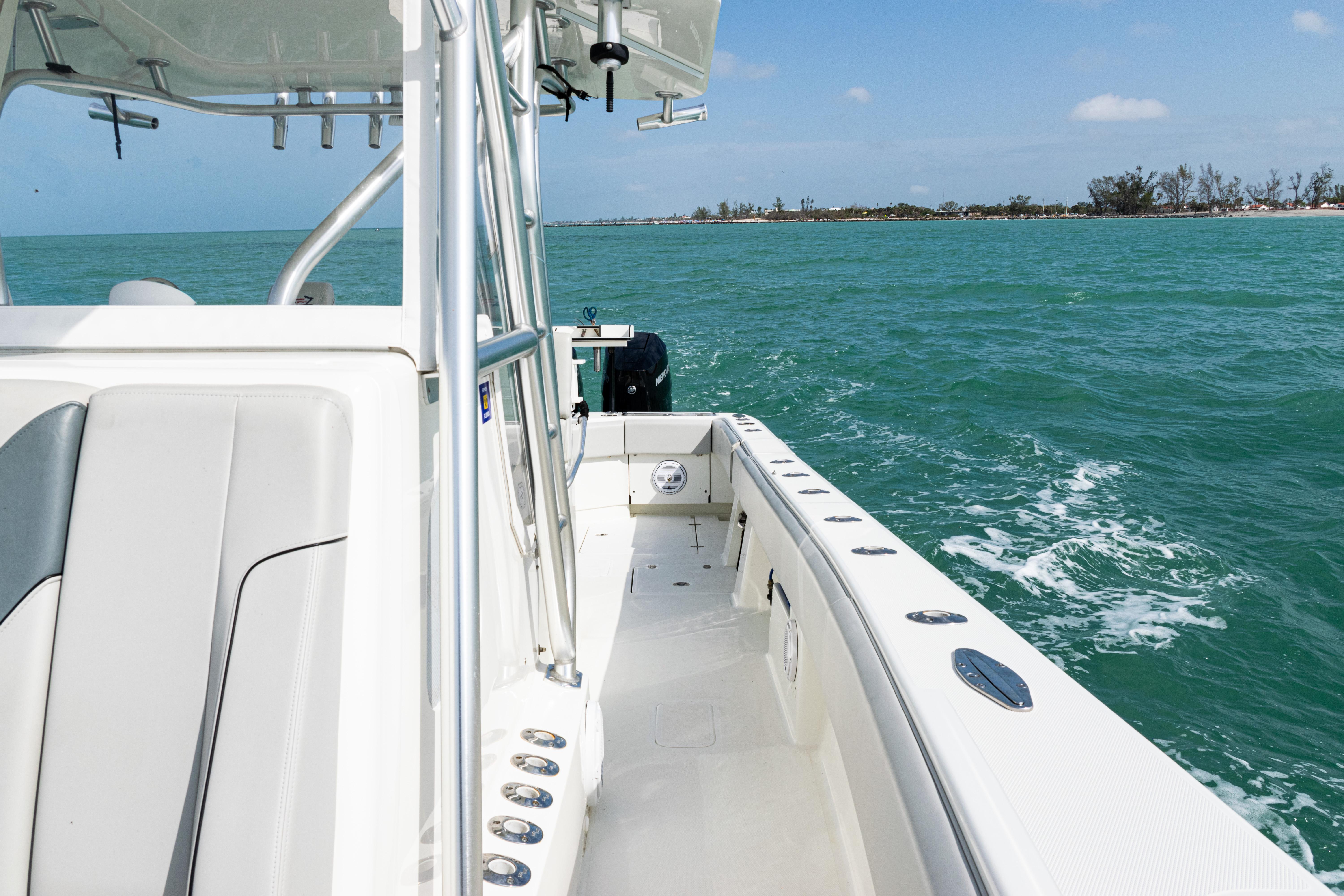 SeaVee-390Z 2015 -FL-US-2015 SeaVee 390Z boat cruising on turquoise waters near a distant shoreline.-9741010 | Thumbnail
