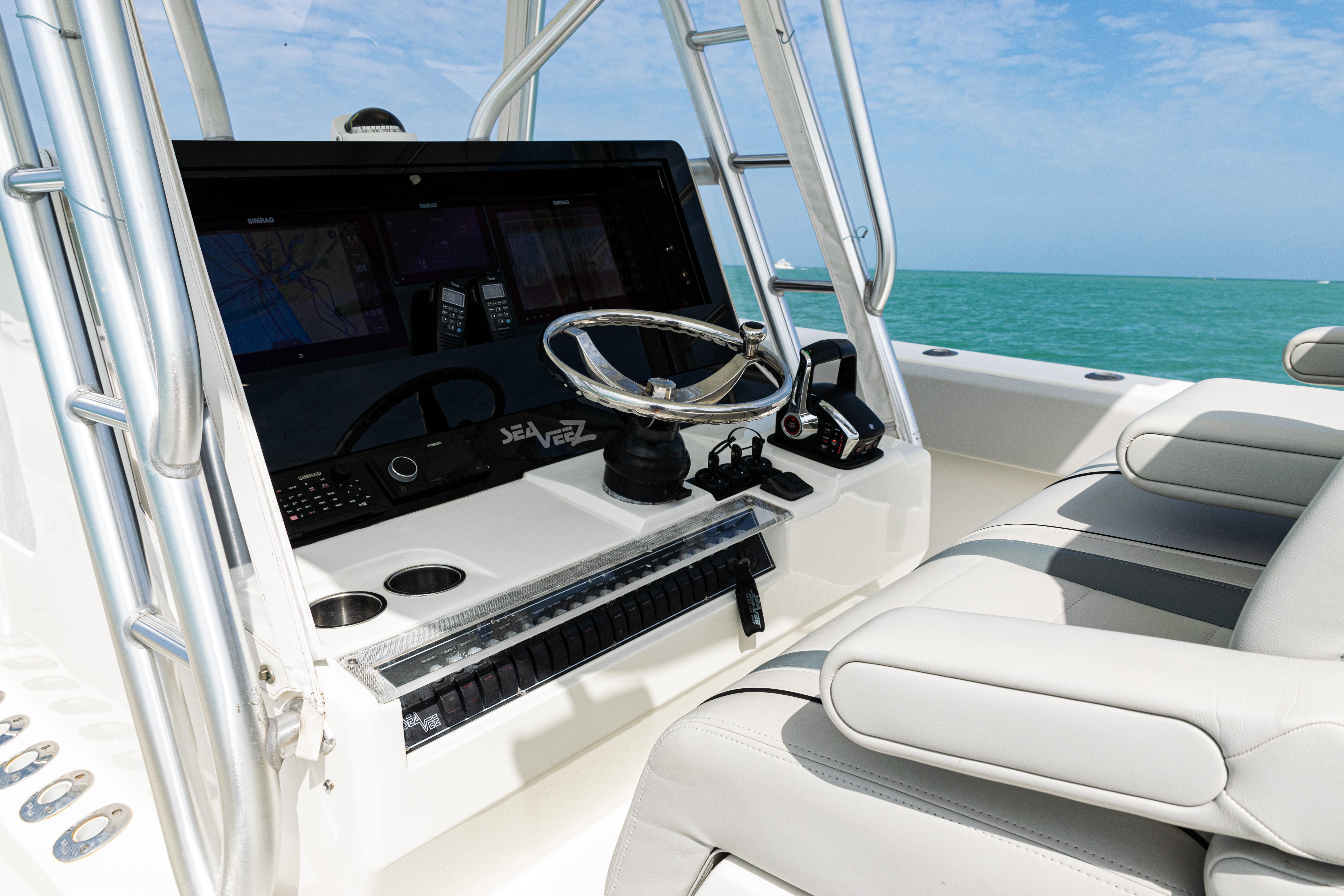 SeaVee-390Z 2015 -FL-US-2015 SeaVee 390Z boat console with steering wheel, controls, and seating, against ocean backdrop.-9741010 | Thumbnail