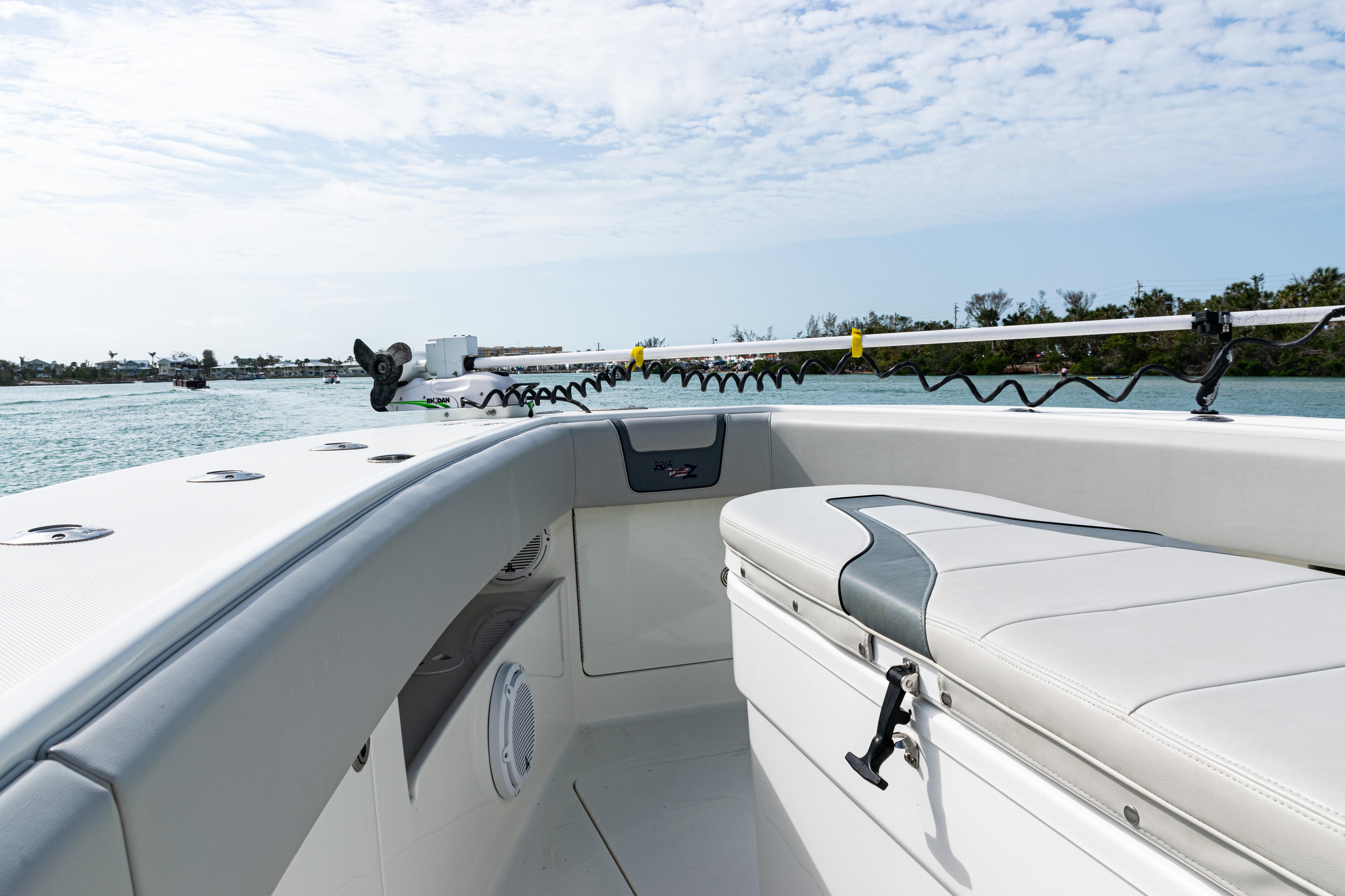 SeaVee-390Z 2015 -FL-US-2015 SeaVee 390Z boat interior with cushioned seating and rod holders on a sunny day.-9741010 | Thumbnail