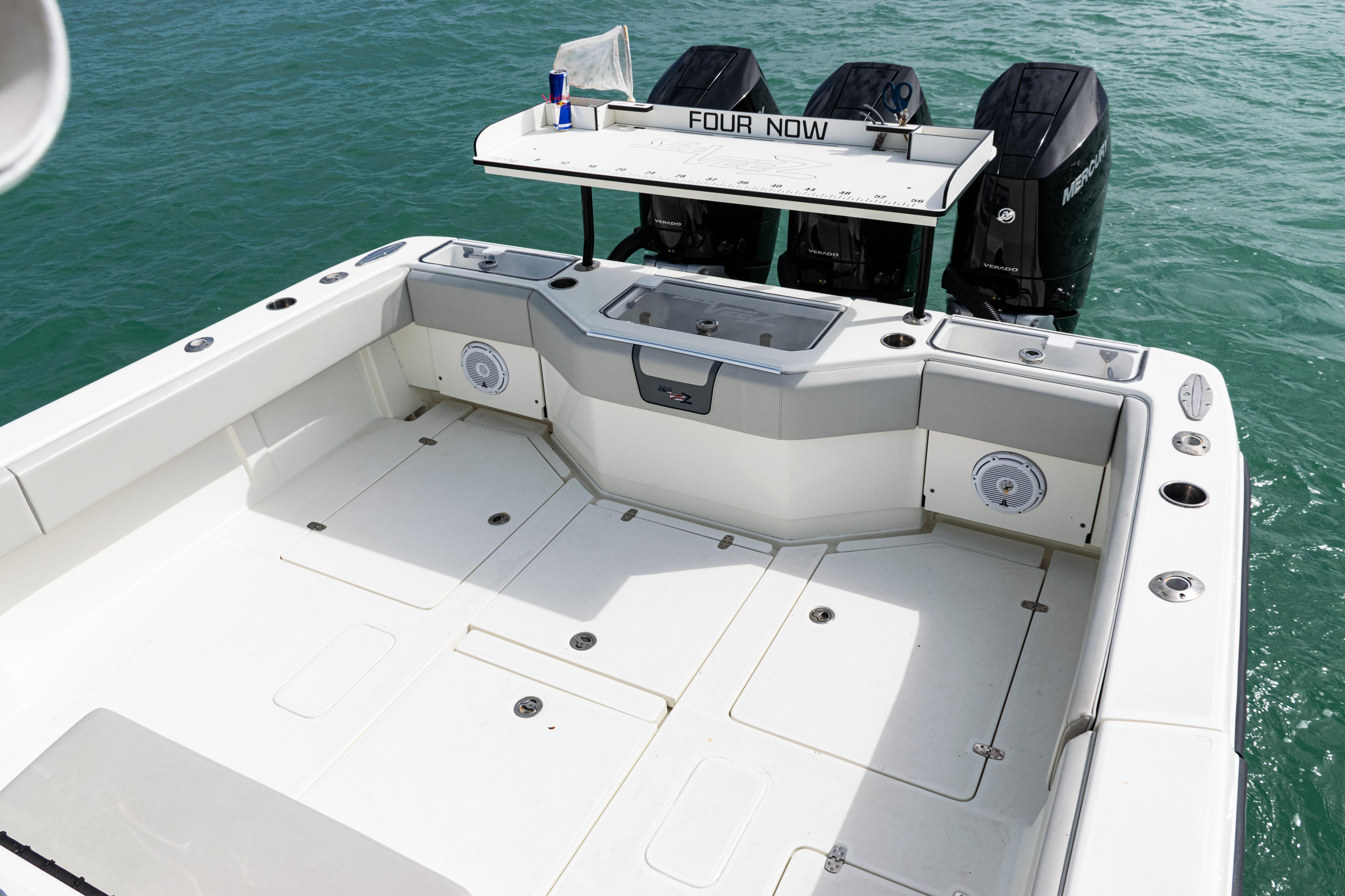 SeaVee-390Z 2015 -FL-US-2015 SeaVee 390Z boat deck with triple outboard engines on clear water.-9741010 | Thumbnail
