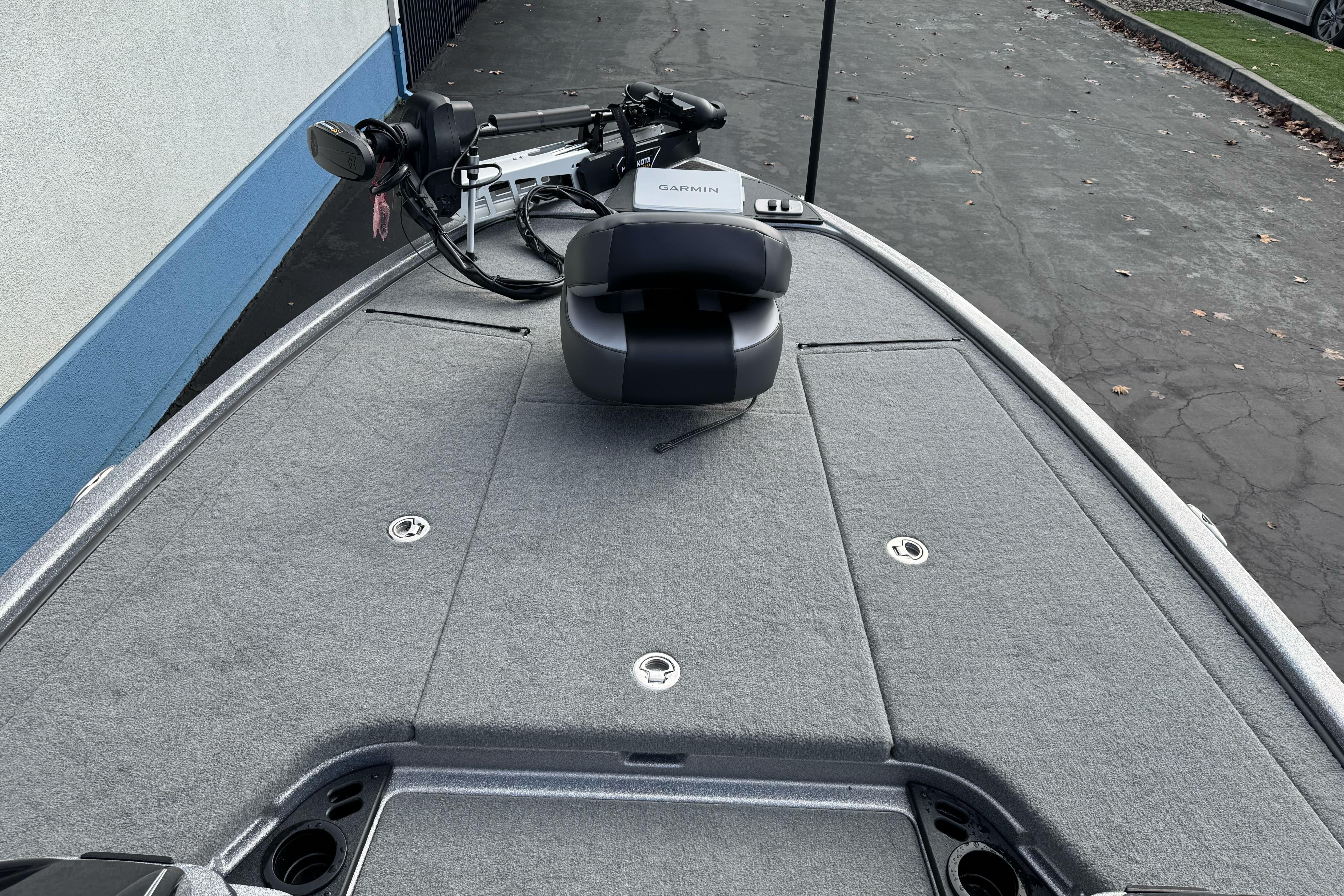 2026 Nitro Z19 XL boat deck with Garmin equipment, featuring a sleek, carpeted surface.