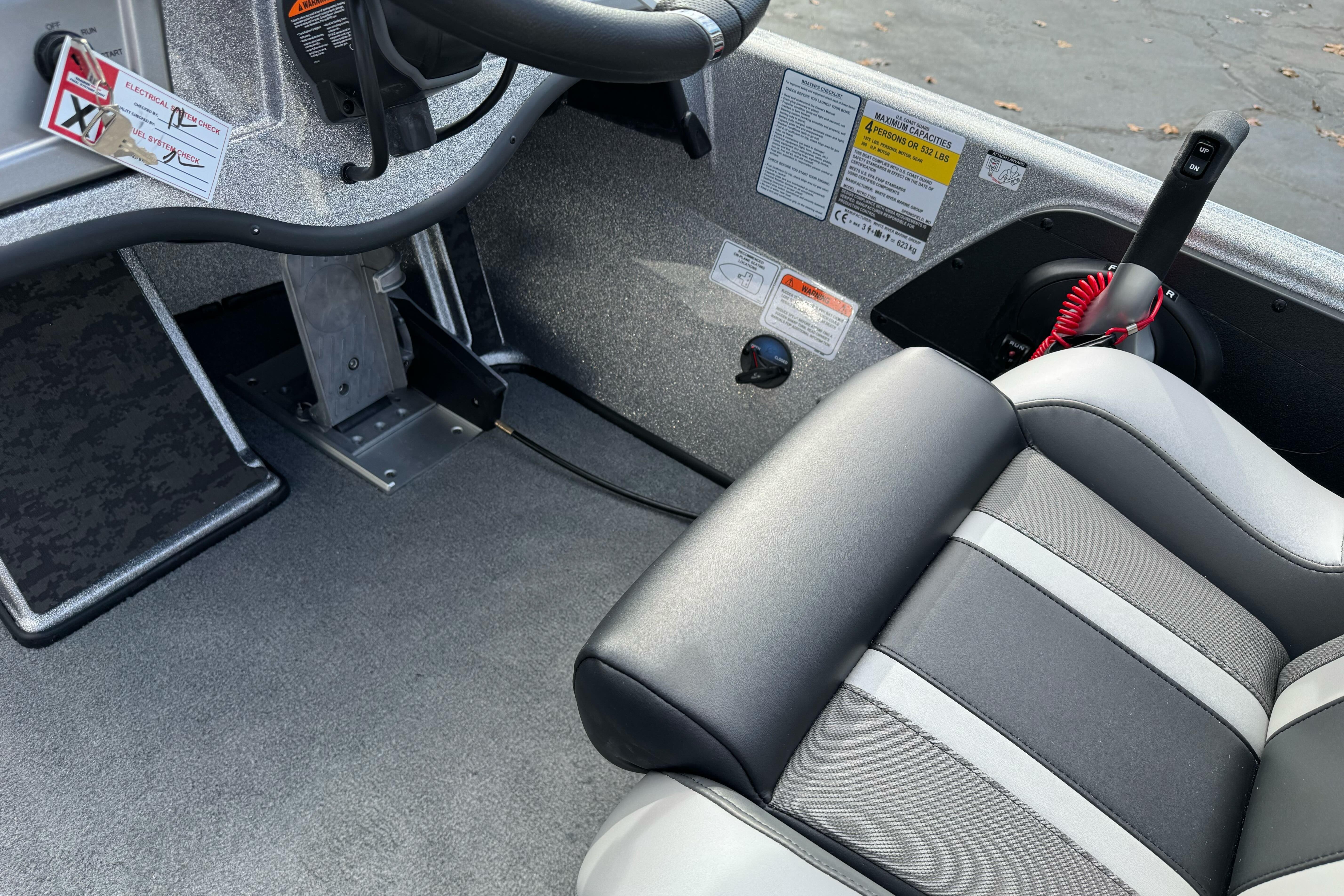 Interior of 2026 Nitro Z19 XL boat showing steering and seating area.