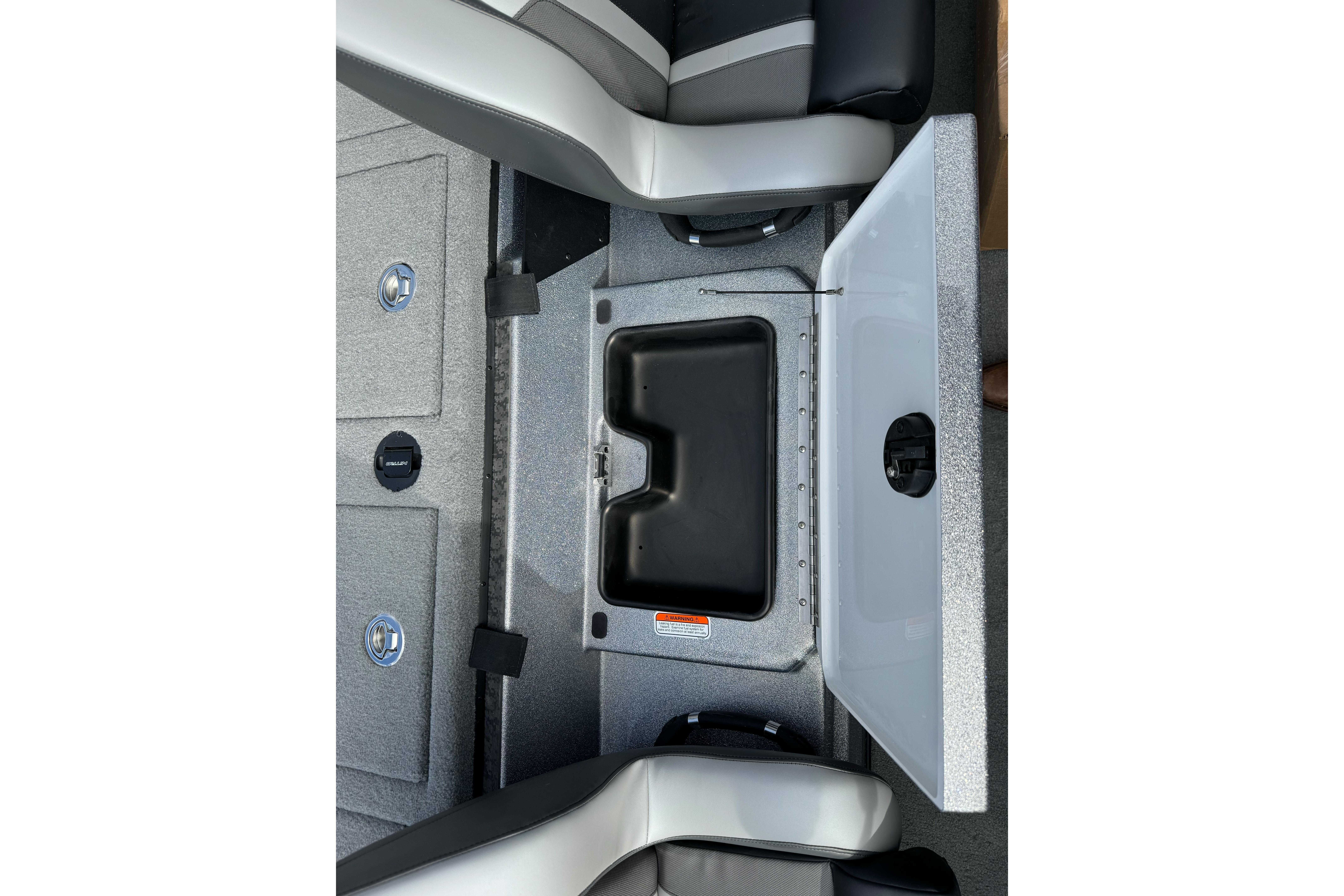 2026 Nitro Z19 XL boat storage compartment with open lid and seating.