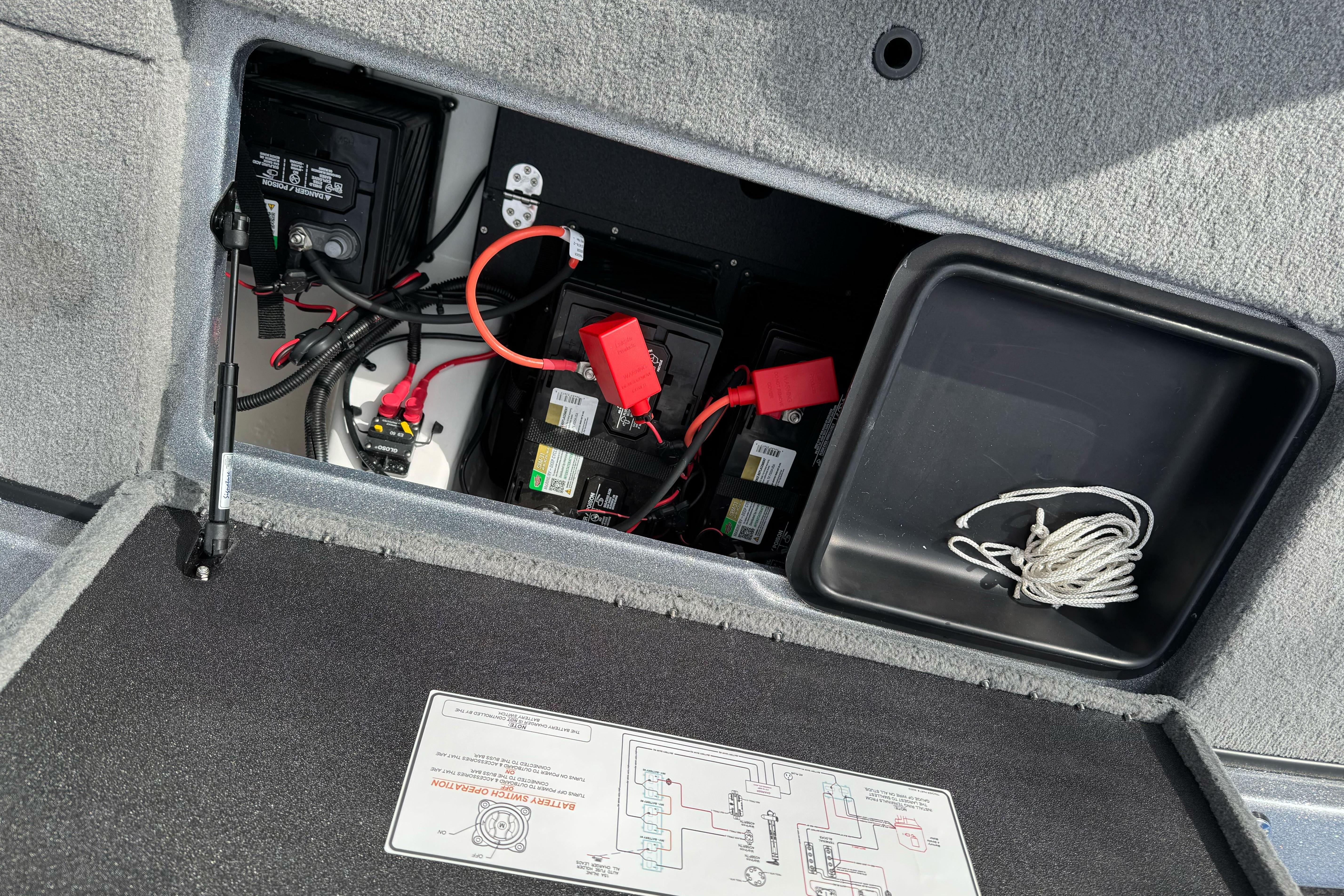 2026 Nitro Z19 XL boat battery compartment with wiring and storage.