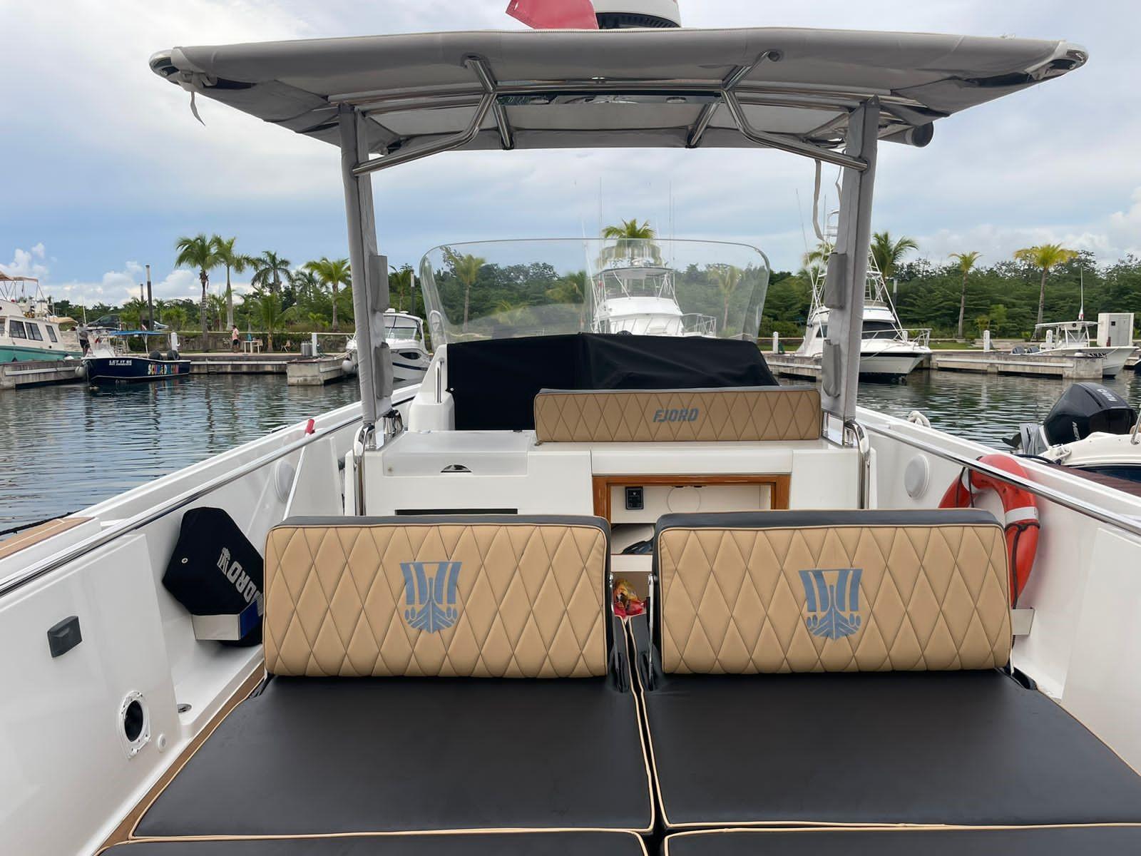 Fjord-36 Open 2018 -FL-US-2018 Fjord 36 Open boat docked at a marina with tan seating.-9391029 | Thumbnail