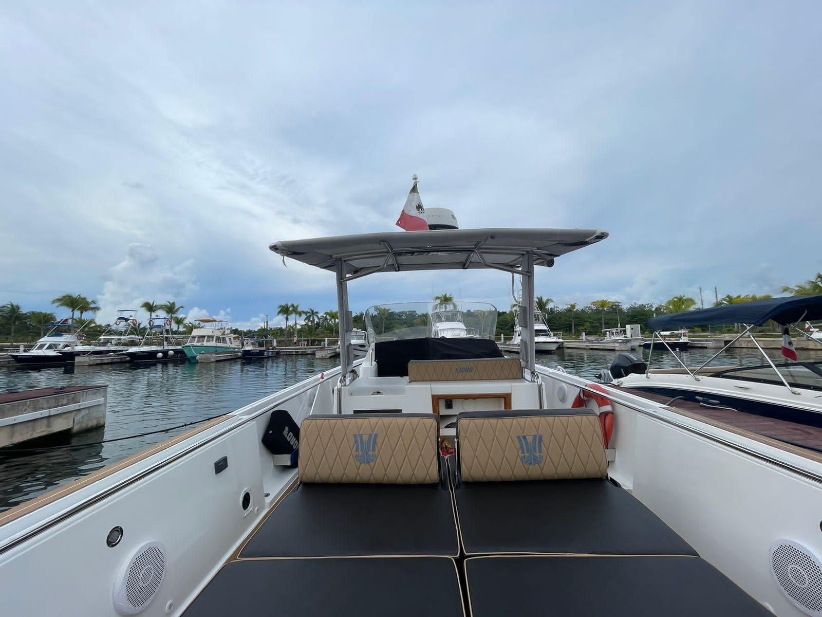 Fjord-36 Open 2018 -FL-US-2018 Fjord 36 Open boat docked at a marina with a canopy and seating area.-9391029 | Thumbnail