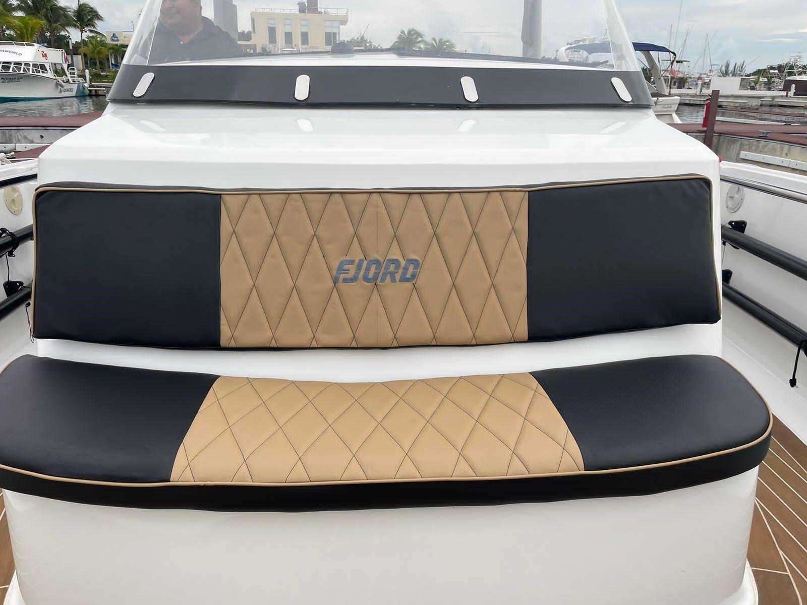 Fjord-36 Open 2018 -FL-US-Fjord 36 Open 2018 boat with tan and black cushioned seating at the dock.-9391029 | Thumbnail