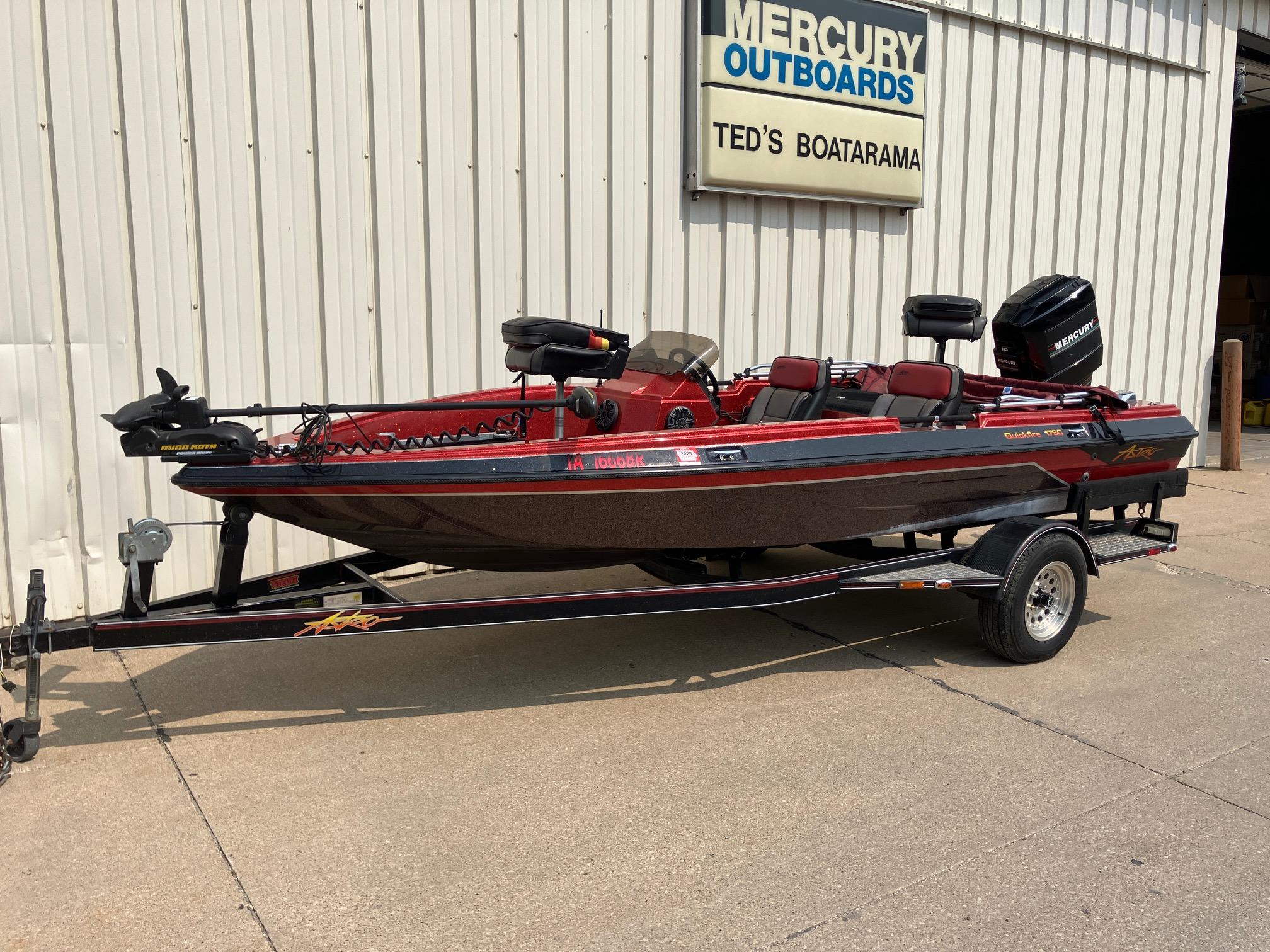 1990 Astro 17 1/2' Bass Boat on trailer outside Ted's Boatarama.
