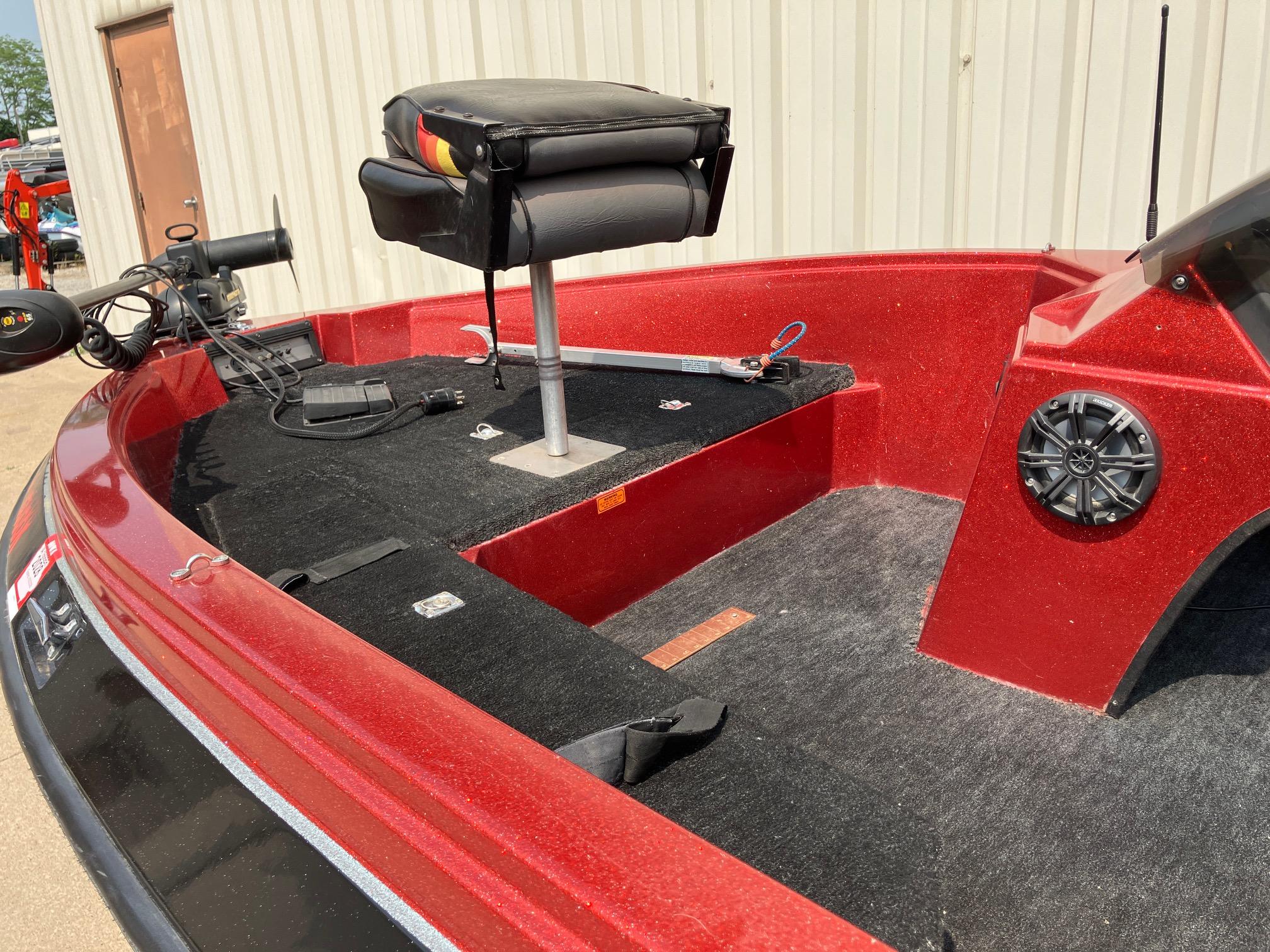 1990 Astro 17 1/2' Bass Boat with red interior and fishing seat.