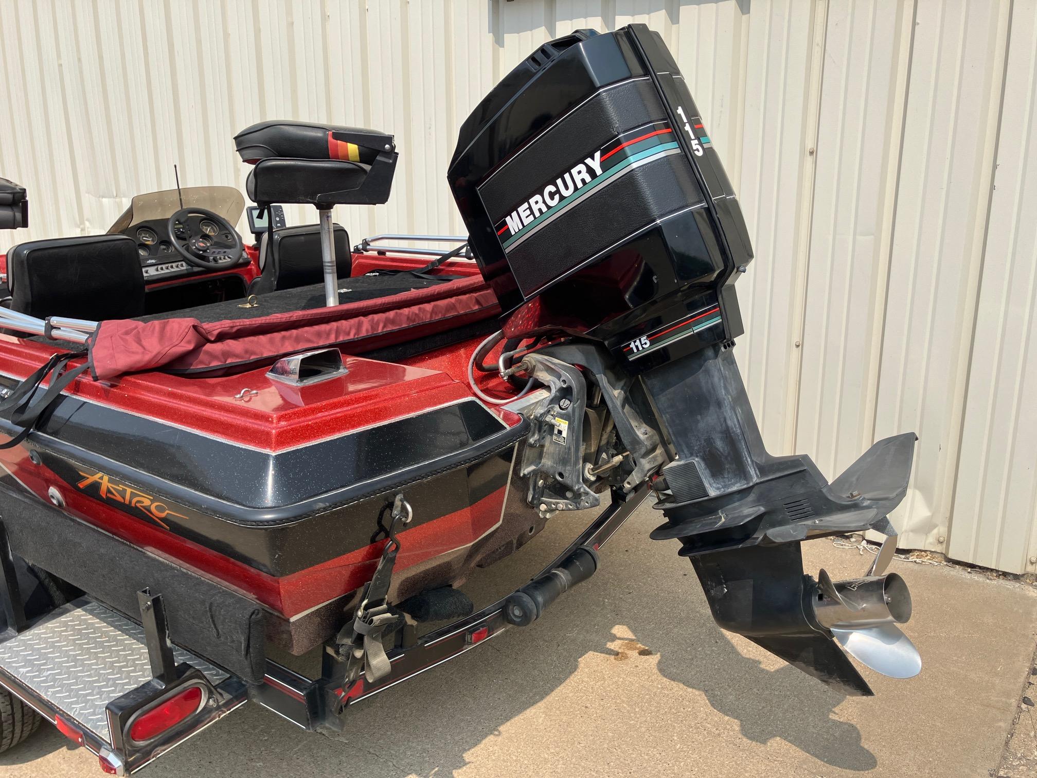 1990 Astro 17 1/2' Bass Boat with Mercury outboard motor, red and black design.