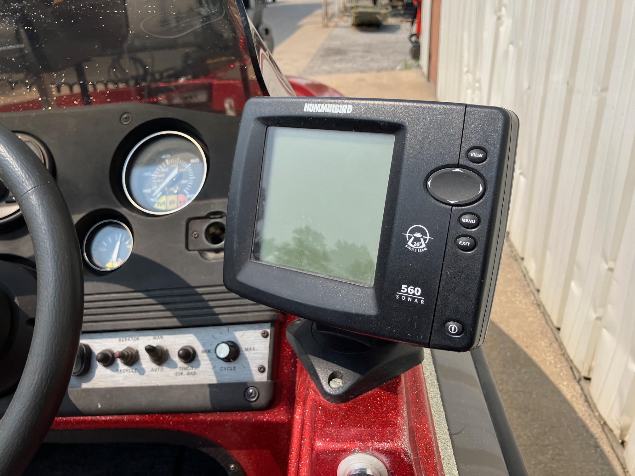 Dashboard of a 1990 Astro 17 1/2' Bass Boat with Humminbird 560 sonar device.